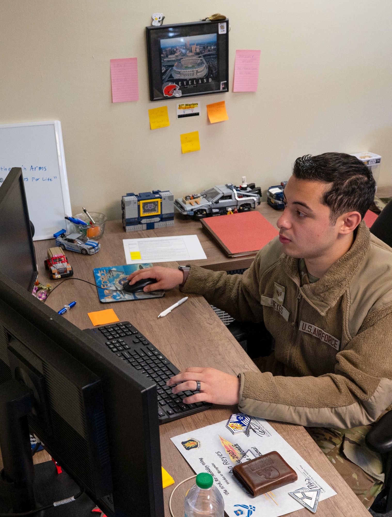 U.S. Air Force Senior Airman Joshua Reyes,97th Air Mobility Wing Chapel Office religious affairs airman, works at his desk at Altus Air Force Base, Oklahoma, Sept. 29, 2025. Reyes was awarded Airman of the Month for August with his commitment to take on higher responsibilities within the unit.(U.S. Air Force photo by Tech. Sgt. Hailey Haux)