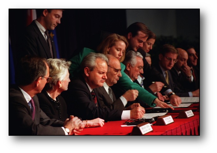 Delegates at a table during Dayton Peace Accords