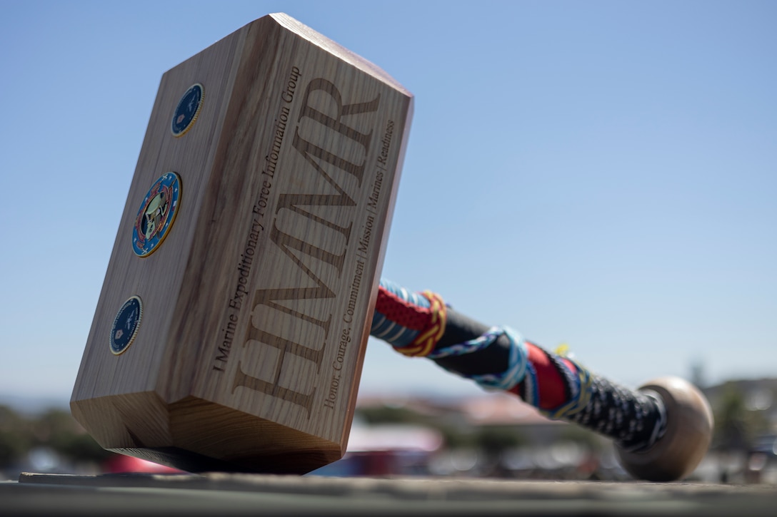 U.S. Marines with I Marine Expeditionary Force Information Group compete in different events to win the HMMR trophy during HMMR Day at Marine Corps Base Camp Pendleton, Oct. 1, 2025. HMMR day, named for the motto of I MIG, honor, courage, commitment; mission; Marines; readiness, brought together all five battalions and the headquarters element to compete in a field meet that focused on individual warfighting readiness and unit cohesion. (U.S. Marine Corps photo by Sgt. Kristin Louise Long)