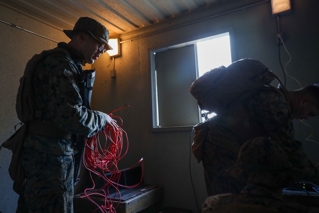 U.S. Marines Corps Smith Nicholes, a transmission systems operator with 9th Communication Battalion, I Marine Expeditionary Force Information Group, establishes communication networks while conducting a hasty command and control center training simulation at Marine Corps Base Camp Pendleton, California, Nov. 18, 2025. This training allows for Marines with 9th Comm Bn to strengthen their skills and teamwork in establishing communications in degraded environments.  (U.S. Marine Corps photo by Lance Cpl. Gregory Hudson)