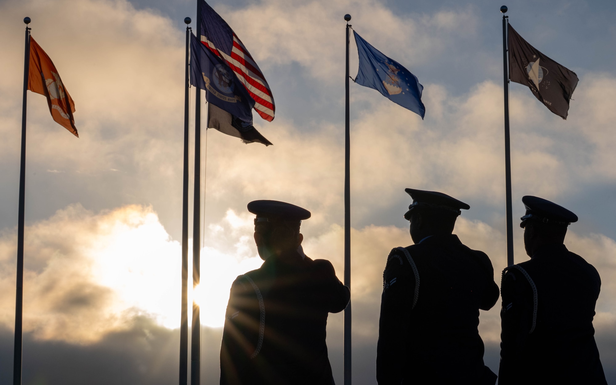 Honor guardsmen assigned to the 6th Force Support Squadron, salute the flag during an induction ceremony at MacDill Air Force Base, Florida, Oct. 28, 2025. Honor guard provides support to military ceremonies honoring distinguished guests, change of commands, retreats, retirements, parades and other appropriate community events attended by the general public. The mission of the MacDill AFB Honor Guard is to represent every Airman by providing top-notch, professional military support to the base, Tampa Community and surrounding areas with honor and dignity. (U.S. Air Force photo by Airman 1st Class Monique Stober)