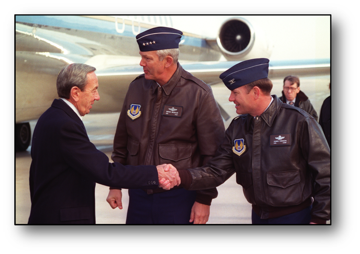 Three men shaking hands