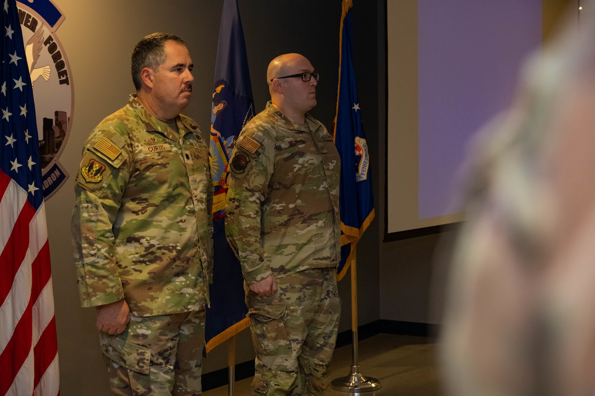 Lt. Col. Michael Curtis awards Tech. Sgt. Devin Miller with the Air Force Combat Action Medal.