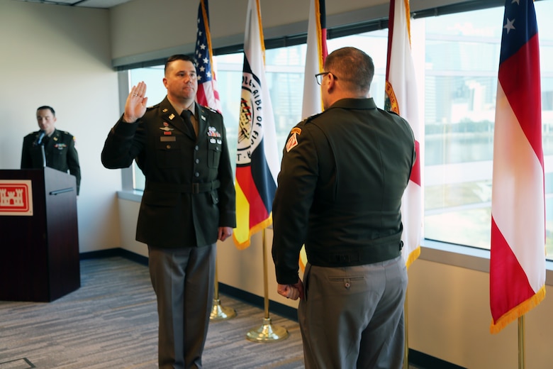 Lt. Col. Matthew Westcott, U.S. Army Corps of Engineers Jacksonville District Deputy District, recites the oath of office administered by U. S. Army Col. Brandon Bowman, U.S. Army Corps of Engineers Jacksonville District Commander, during Westcott’s promotion ceremony at the Jacksonville District Headquarters, Nov. 13, 2025. The oath signifies the officer’s continued commitment to uphold and defend the Constitution of the United States. (U.S. Army photo by Mark Rankin).