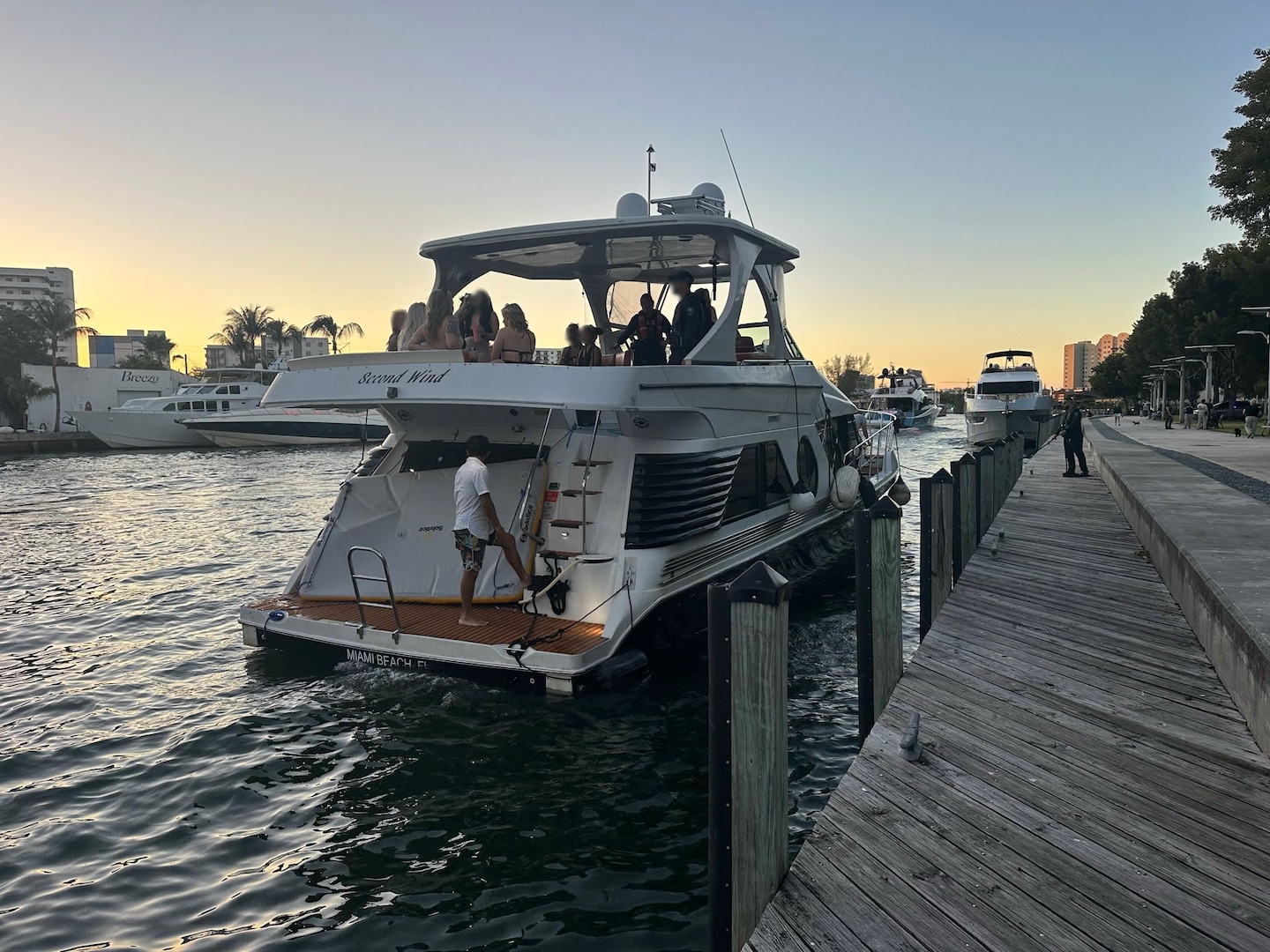 U.S. Coast Guard law enforcement officers board the 52-foot motor vessel Second Wind near Lummus Park, Florida, Nov. 15, 2025. Second Wind was found to be operating as an illegal small passenger vessel, violating an active Captain of the Port order. (U.S. Coast Guard courtesy photo)