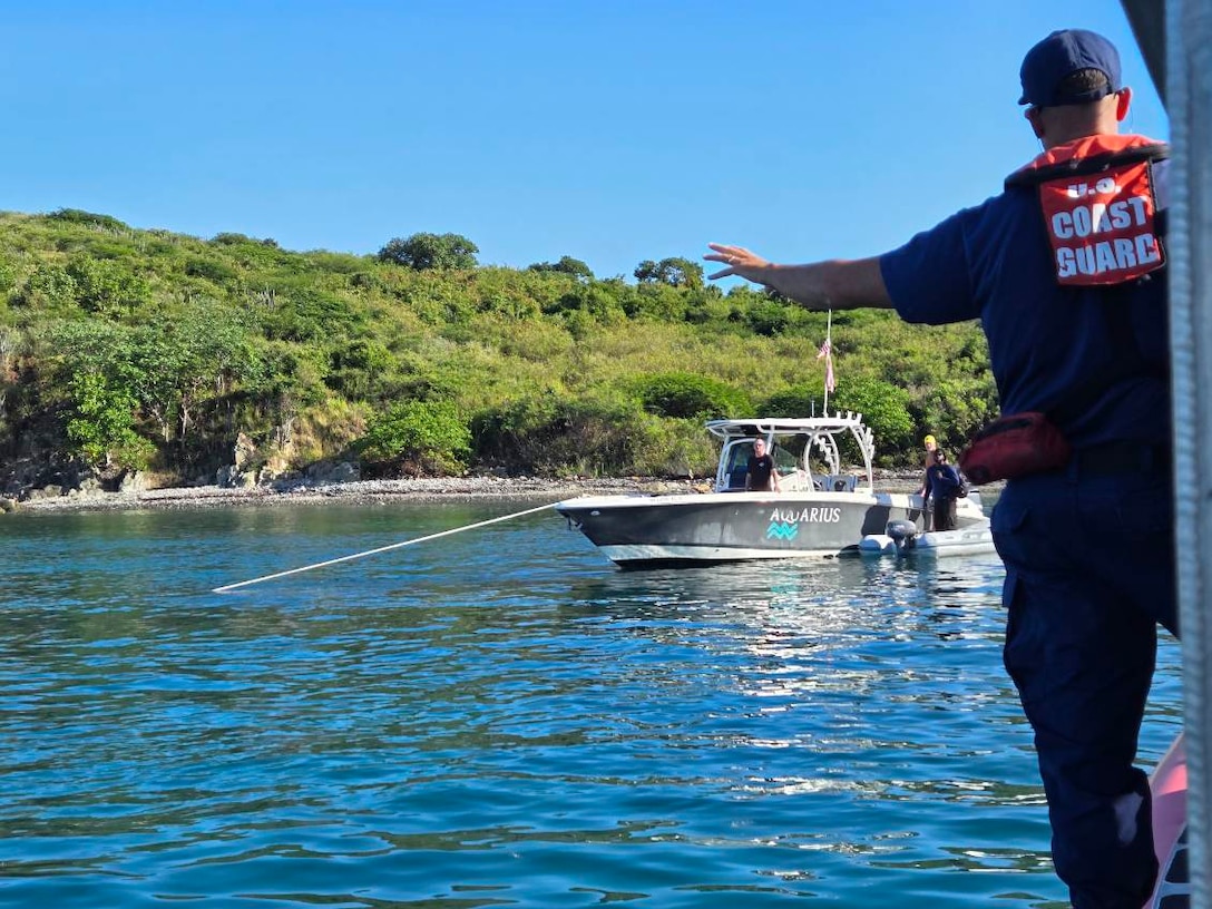 A Coast Guad Boat Forces Unit U.S. Virgin Islands 33-foot Special Craft surface unit is on-scene with the recreational vessel Aquarius during the vessel Cool Change grounding response in the vicinity of Christmas Cove, St. Thomas, U.S. Virgin Islands, Nov. 20, 2025.  The vessel Aquarius rescued the captain of the vessel which remains a ground and partially submerged. (U.S. Coast Guard photo).