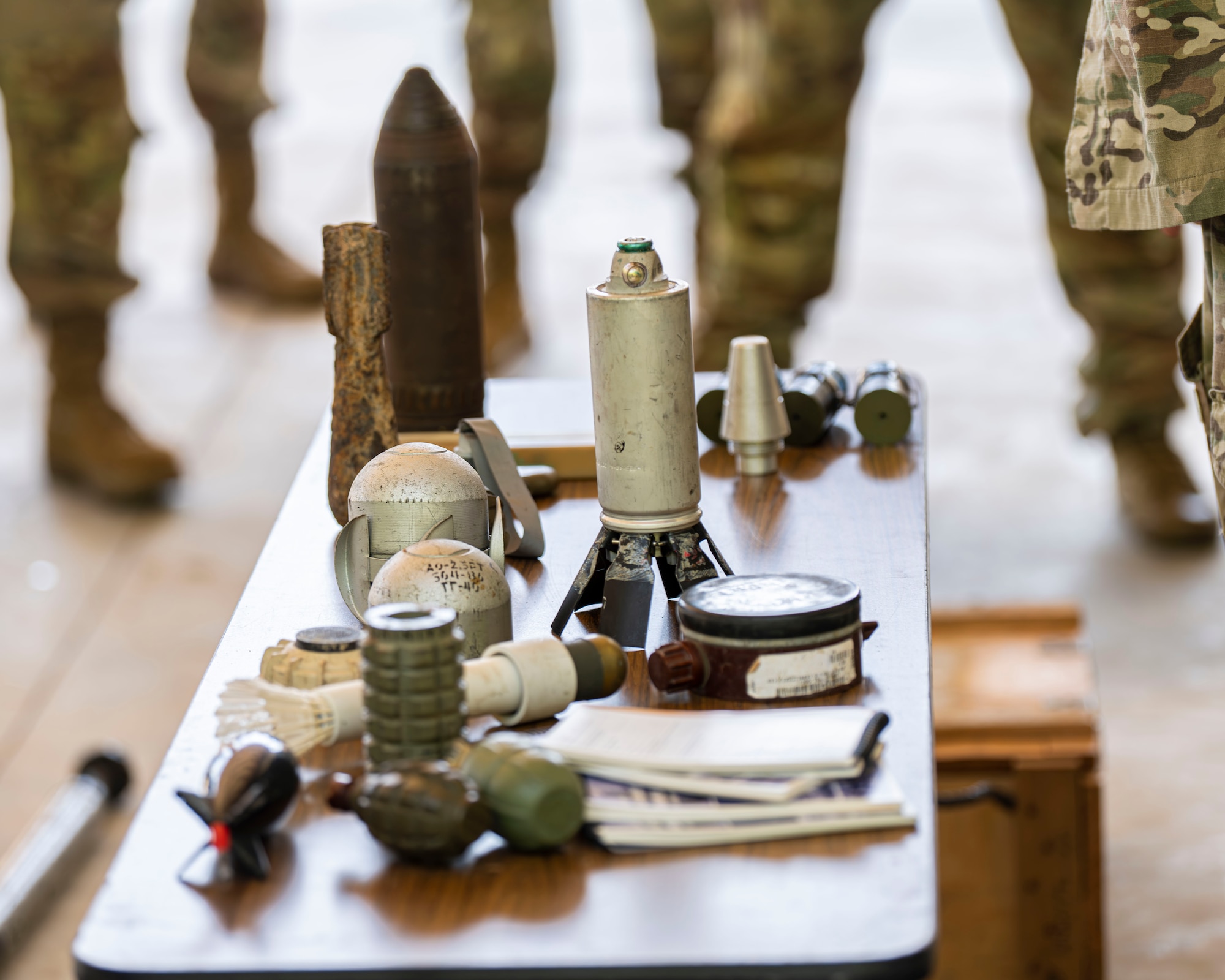 An array of inert or non-functional explosives is displayed during Mission Ready Airmen Training.