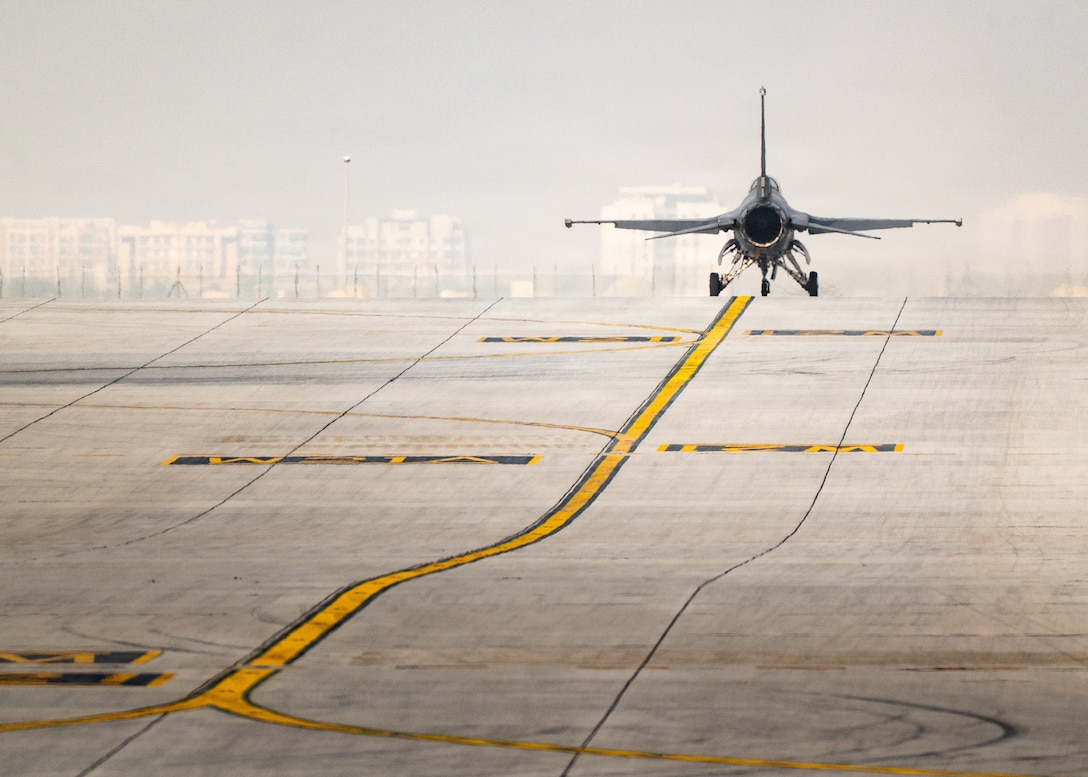 A U.S. Air Force F-16C Fighting Falcon assigned to the 31st Fighter Wing at Aviano Air Base, Italy, taxis before flight during an airshow at Dubai, United Arab Emirates, Nov. 16, 2025. The Viper Demonstration Team performs dynamic aerial demonstrations for audiences worldwide, showcasing the professionalism and technical excellence of U.S. Airmen. (U.S. Air Force photo by Staff Sgt. Steven Cardo)