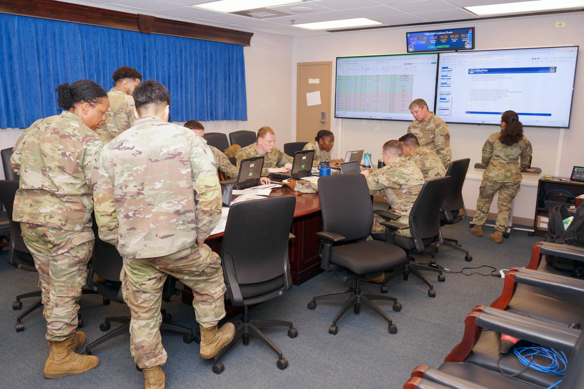 Airmen from the 735th Air Mobility Squadron work through a surge-operations scenario during Tabletop Exercise 2.0, using realistic injects to guide decision-making at Joint Base Pearl Harbor-Hickam, Sept. 25–Oct. 1, 2025