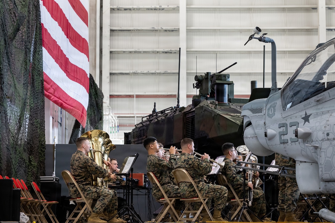 U.S. Marines with 2nd Marine Division Band play for service members and their families at Marine Corps Air Station (MCAS) New River in Jacksonville, North Carolina, Nov.19, 2025. Mrs. Melania Trump and Mrs. Usha Vance made their first visit to a military installation under the second Trump Administration to show appreciation for military families and those who serve this holiday season. During their visit they spent time with students creating holiday crafts and building care packages for deployed service members. The visit culminated with the two women addressing nearly 1,500 service members and their families at MCAS New River. (U.S. Marine Corps photo by Sgt. Yvonna Stark)