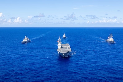 AT SEA, Guam (Nov. 13, 2025) — Japan Maritime Self-Defense Force Hyuga-class helicopter destroyer, JS Hyuga, leads United States Navy Arleigh Burke-class destroyer, USS Fitzgerald (centre-right), Indian Navy Shivalik-class frigate, INS Sahyadri...