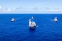 Japan Maritime Self-Defense Force Hyuga-class helicopter destroyer, JS Hyuga, leads United States Navy Arleigh Burke-class destroyer, USS Fitzgerald (centre-right), Indian Navy Shivalik-class frigate, INS Sahyadri (centre-left), and Royal Australian Navy Anzac-class frigate, HMAS Ballarat, during Exercise MALABAR 25 off the coast of Guam.