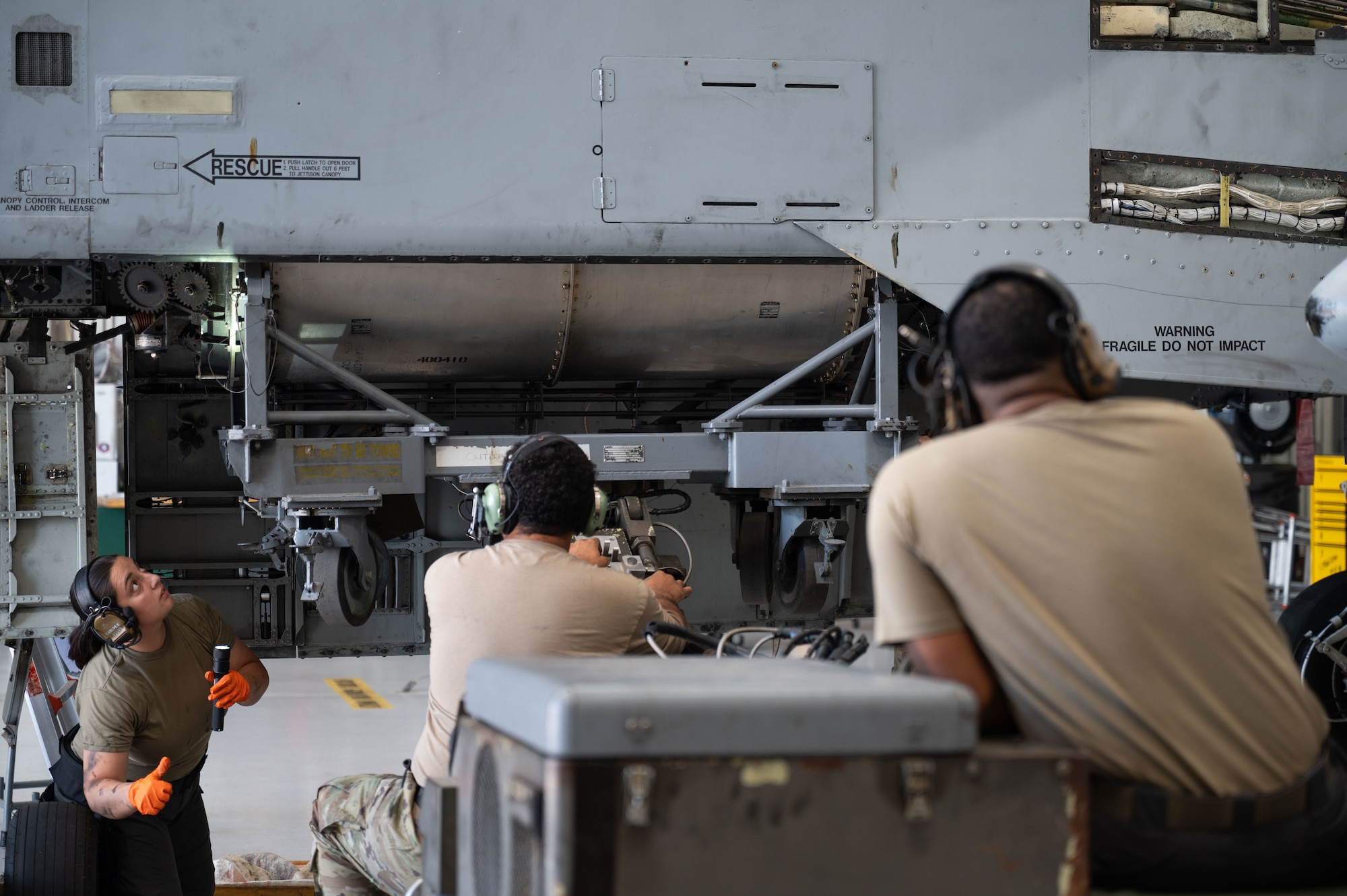 U.S. Air Force Airmen remove the ammunition drum from an A-10C Thunderbolt II aircraft at Davis-Monthan Air Force Base, October 20, 2025. Phase maintenance is a process where the entire aircraft is taken apart, inspected, repaired and put back together to keep the aircraft operational. (U.S. Air Force photo by Airman 1st Class Jaden Kidd)