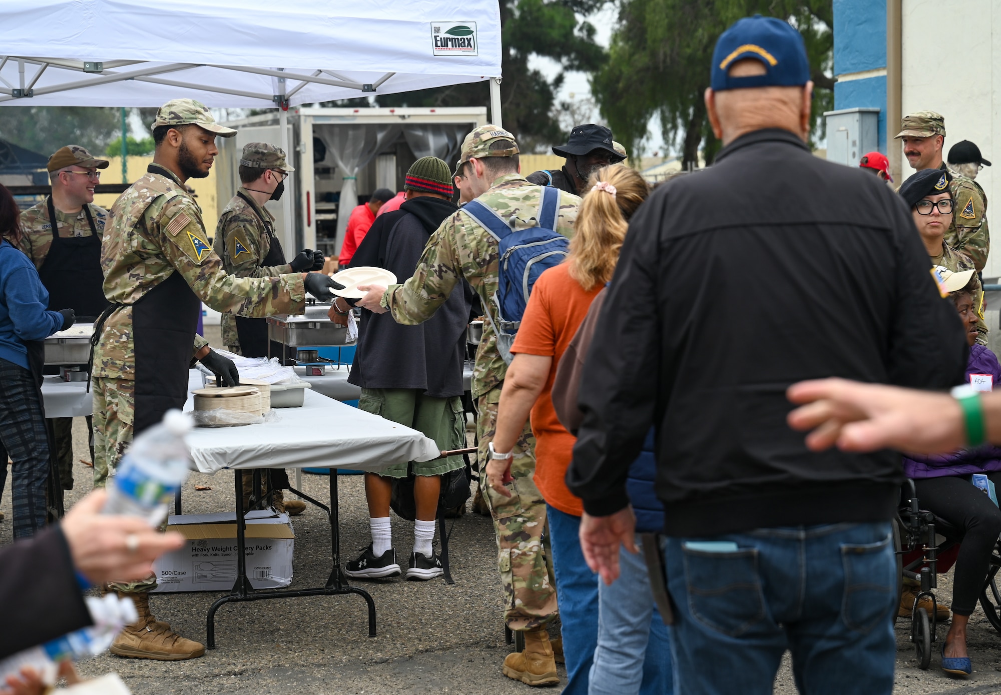U.S. Air and Space Forces active-duty service members from Vandenberg Space Force Base volunteer with community partners to serve food for veterans.