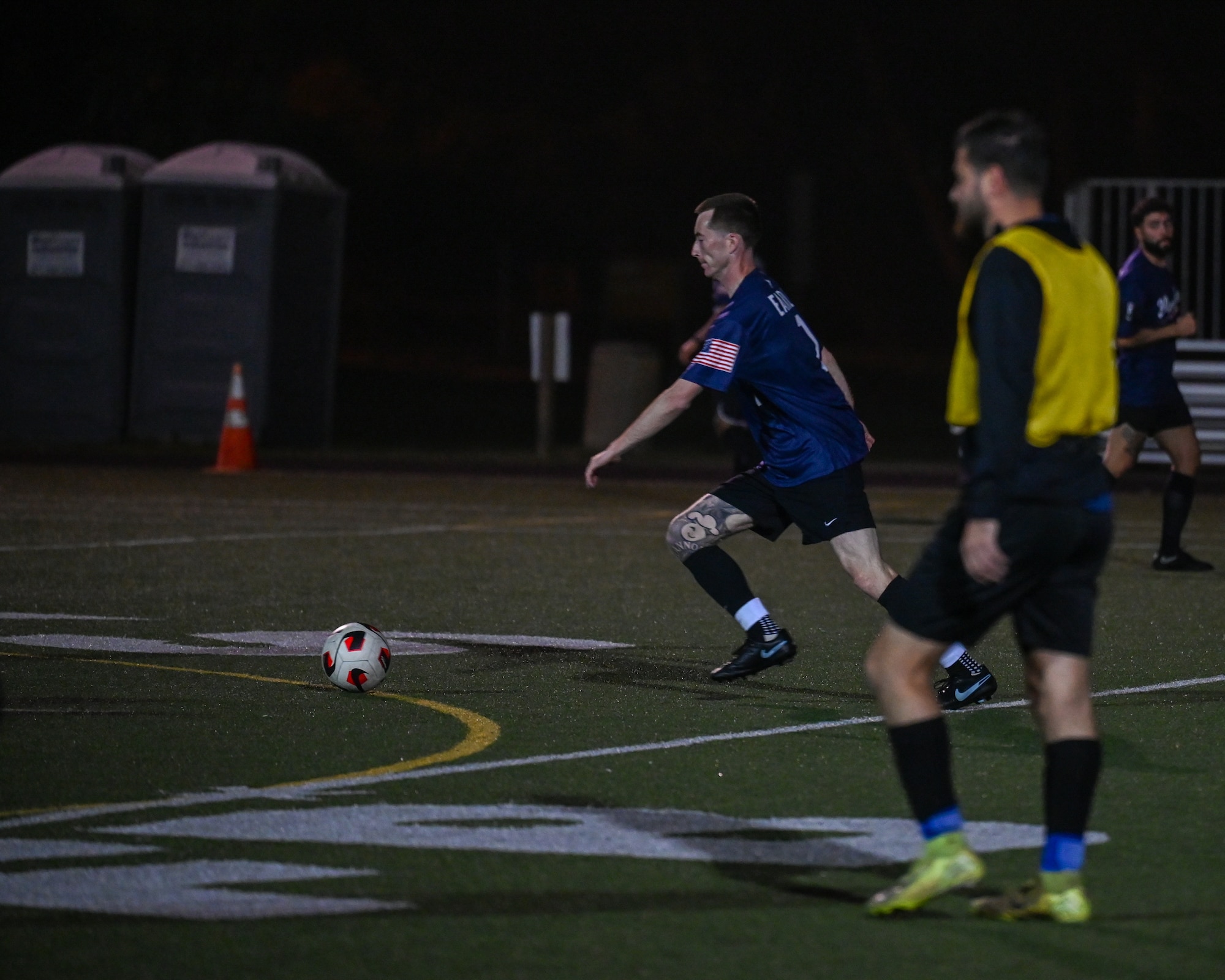U.S. Air Force Staff Sgt. Cameron Earle, 532nd Training Squadron missile maintenance training instructor, dribbles a soccer ball.