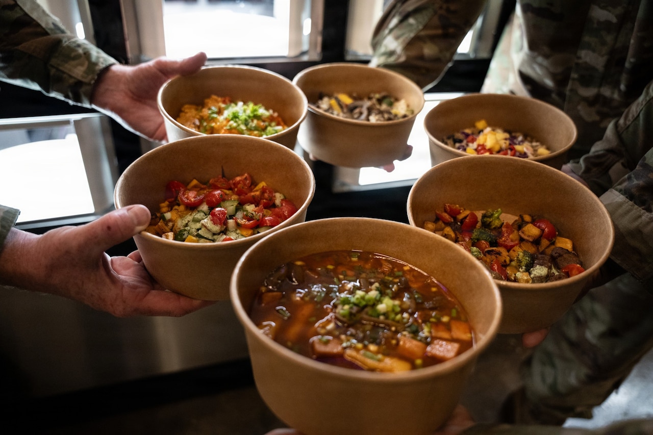 A close-up photo of six bowls containing various fresh ingredients.