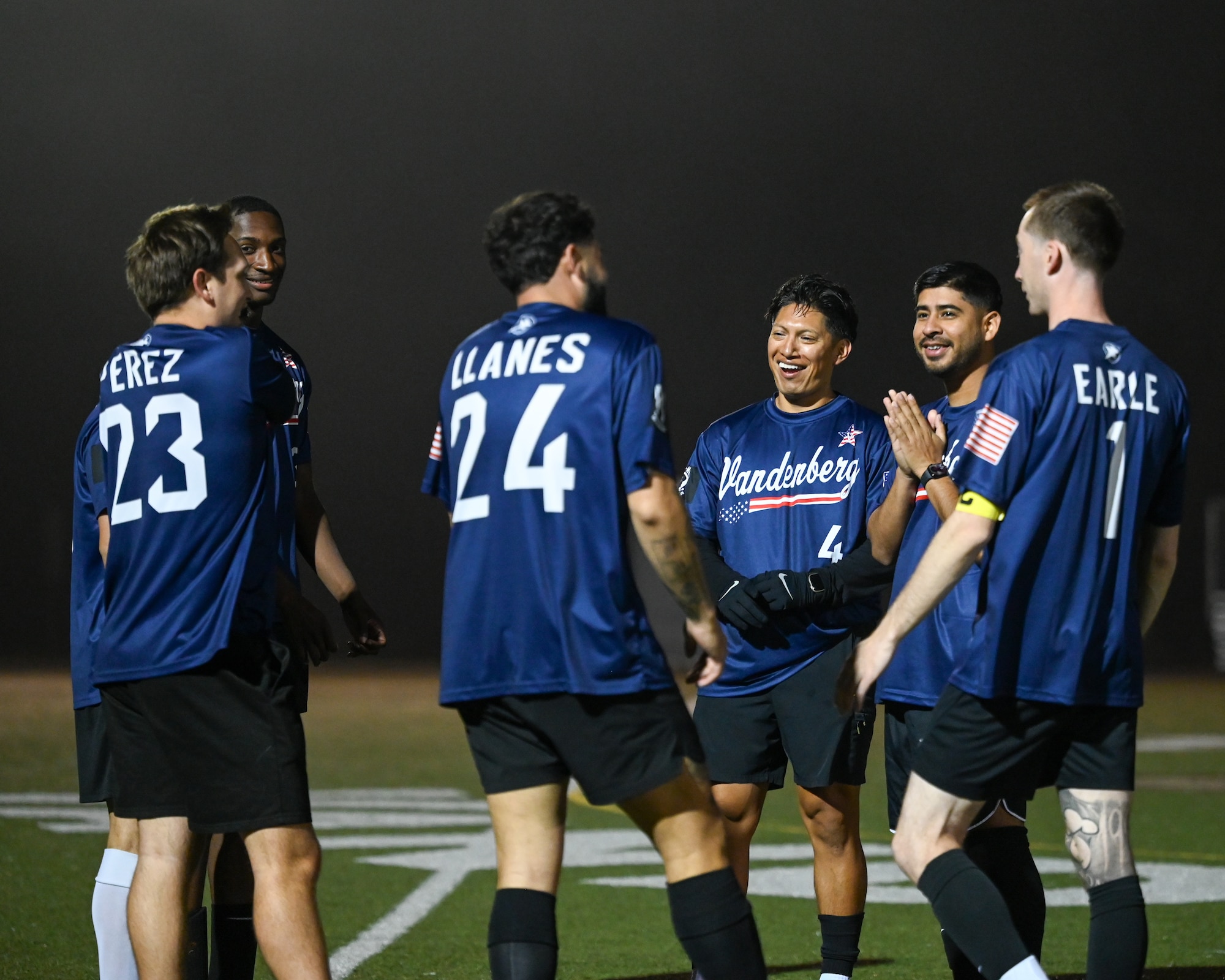 Vandenberg Space Force Base Hawks’ varsity soccer team players talk and discuss tactics before a scrimmage.