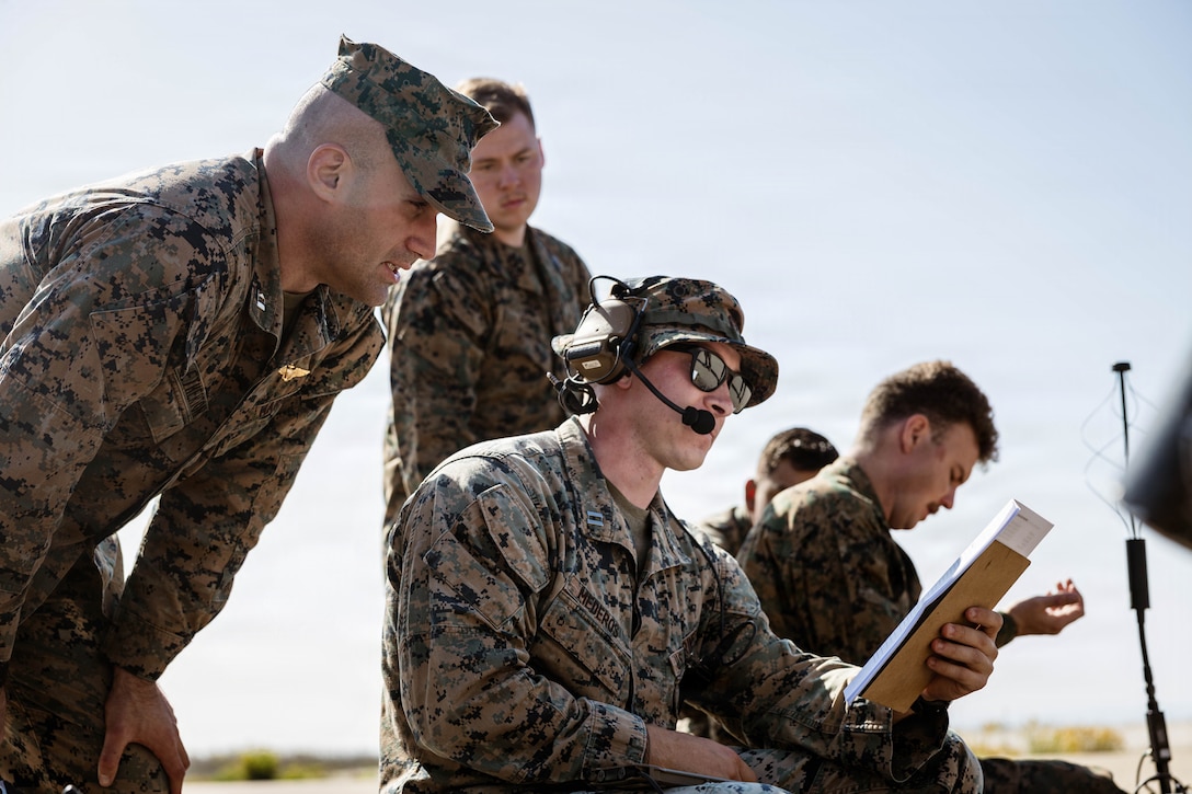 U.S. Marines with 1st Air Naval Gunfire Liaison Company, I Marine Expeditionary Force Information Group, provide ground support to Marine Light Attack Helicopter Squadron 267, Marine Aircraft Group 39, 3rd Marine Air Wing while they conduct familiarization training with the newly integrated Link 16 Targeting Deconfliction System at Marine Corps Base Camp Pendleton, California, Oct. 28, 2025. The Link 16 Targeting Deconfliction System, a secure digital communication network that enhances real-time data exchange and improves command and control. (U.S. Marine Corps Photo by Cpl. Peyton Kahle)