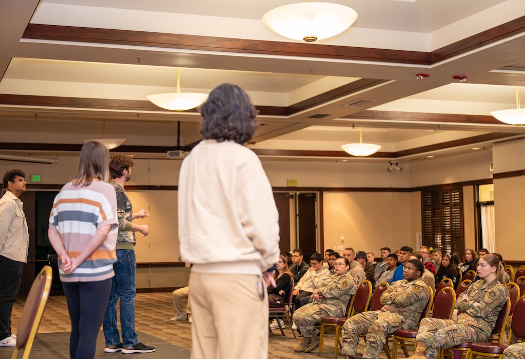 Airmen sit in the audience for a presentation