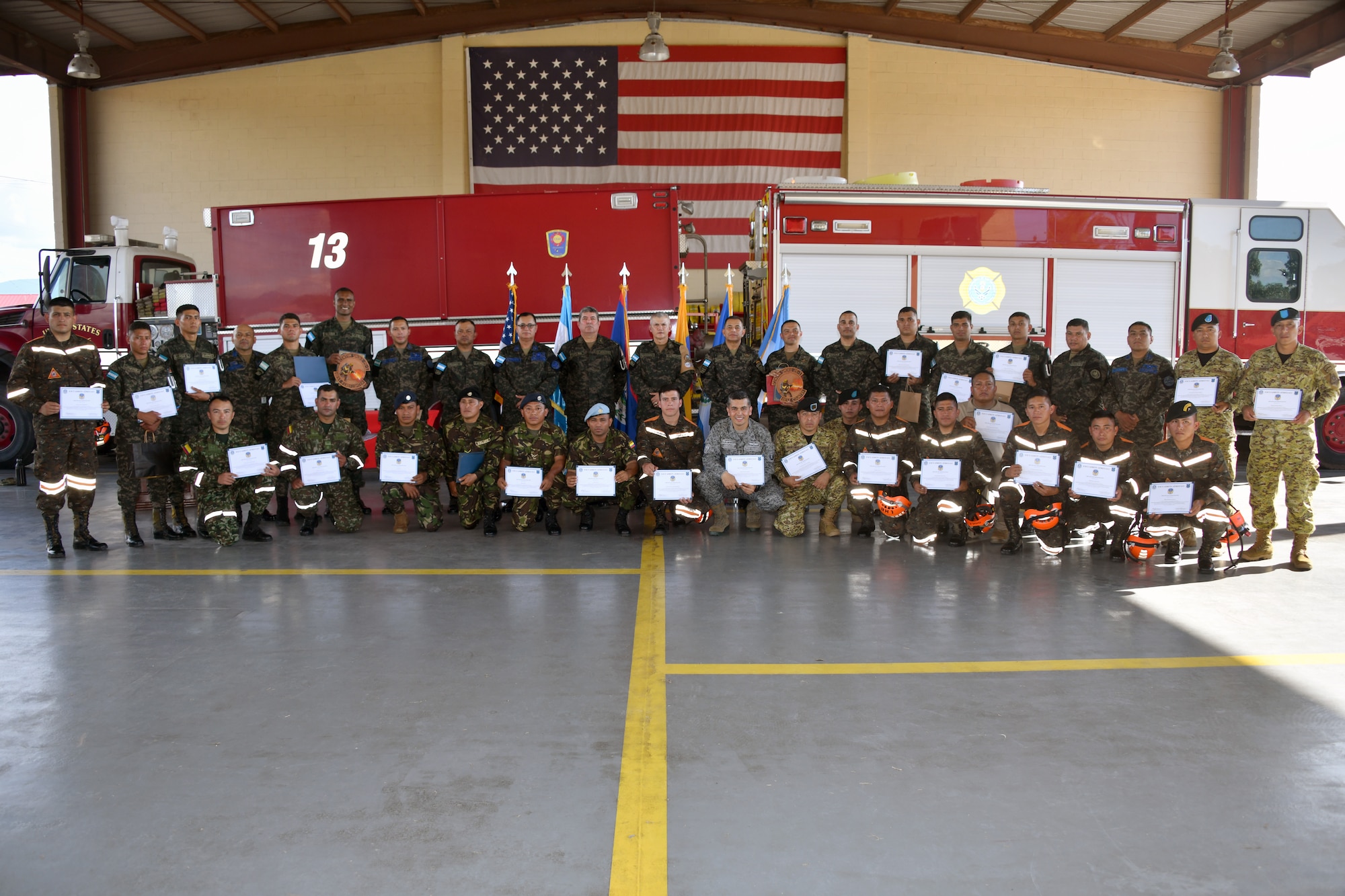 Military members gather around for a photo
