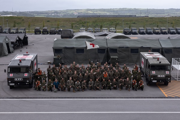 U.S. Marines, Sailors and Japanese Ground Self-Defense Force members pose for a photo during exercise 07JX on Ishigaki, Okinawa, Japan, Oct 25, 2025. 07JX is a bilateral exercise that aims to enhance bilateral Japan-U.S. capabilities for humanitarian assistance and disaster relief operations in the Southwest islands. (U.S. Marine Corps photo by Lance Cpl. Marcus Henson)