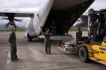 U.S. Marines with Marine Aerial Refueler Transport Squadron 152, Marine Aircraft Group 12, 1st Marine Aircraft Wing, offload medical supplies from a KC-130J as a part of exercise 07JX on Ishigaki, Okinawa, Japan, Oct. 25, 2025. 07JX is a bilateral exercise that aims to enhance bilateral Japan-U.S. capabilities for humanitarian assistance and disaster relief operations in the Southwest islands. (U.S. Marine Corps photo by Lance Cpl. Marcus Henson)