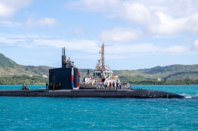 NAVAL BASE GUAM (Nov. 18, 2025) — Los Angeles-class fast-attack submarine USS Asheville (SSN 758) returns to Naval Base Guam, reaffirming its role in the Indo-Pacific, Nov. 18, 2025. Assigned to Commander, Submarine Squadron 15 at Polaris Point,...