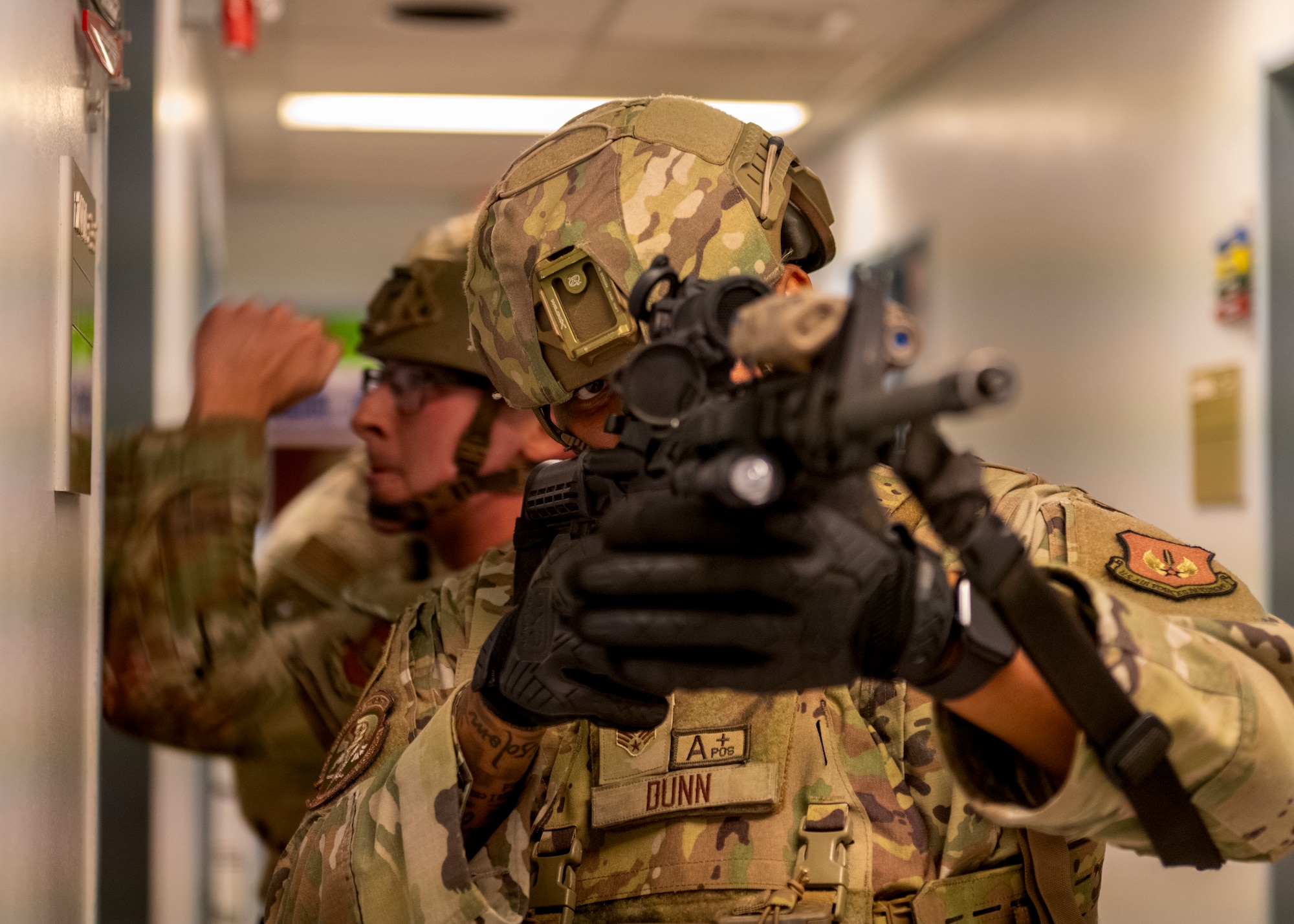 Service members check doors