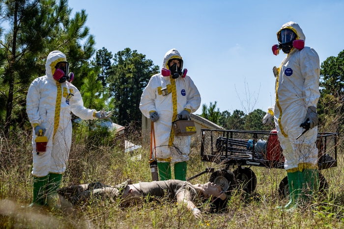 U.S. Air Force 2nd Operational Medical Readiness Squadron bioenvironmental engineering technicians prepare to scan a simulated patient for radioactive contamination during a simulated nuclear response training at Barksdale Air force Base, Louisiana, Oct. 1, 2025. The bioenvironmental engineering flight identifies, evaluates and controls health and environmental hazards for the 2nd Bomb Wing by assessing possible risks from chemicals and radiation. (U.S. Air force photo by Airman 1st Class Devyn Taylor)