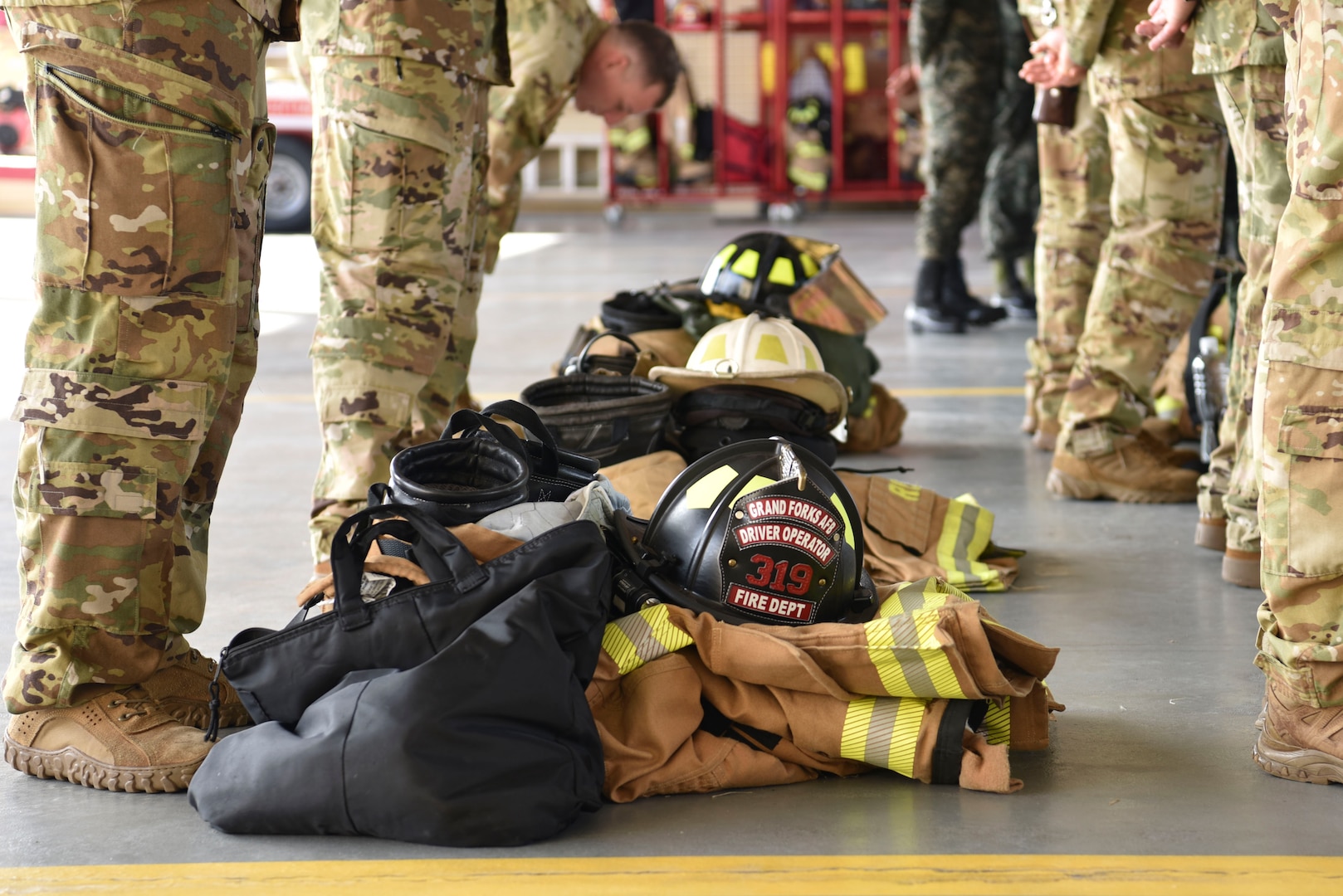 Firefighter equipment lays on the ground