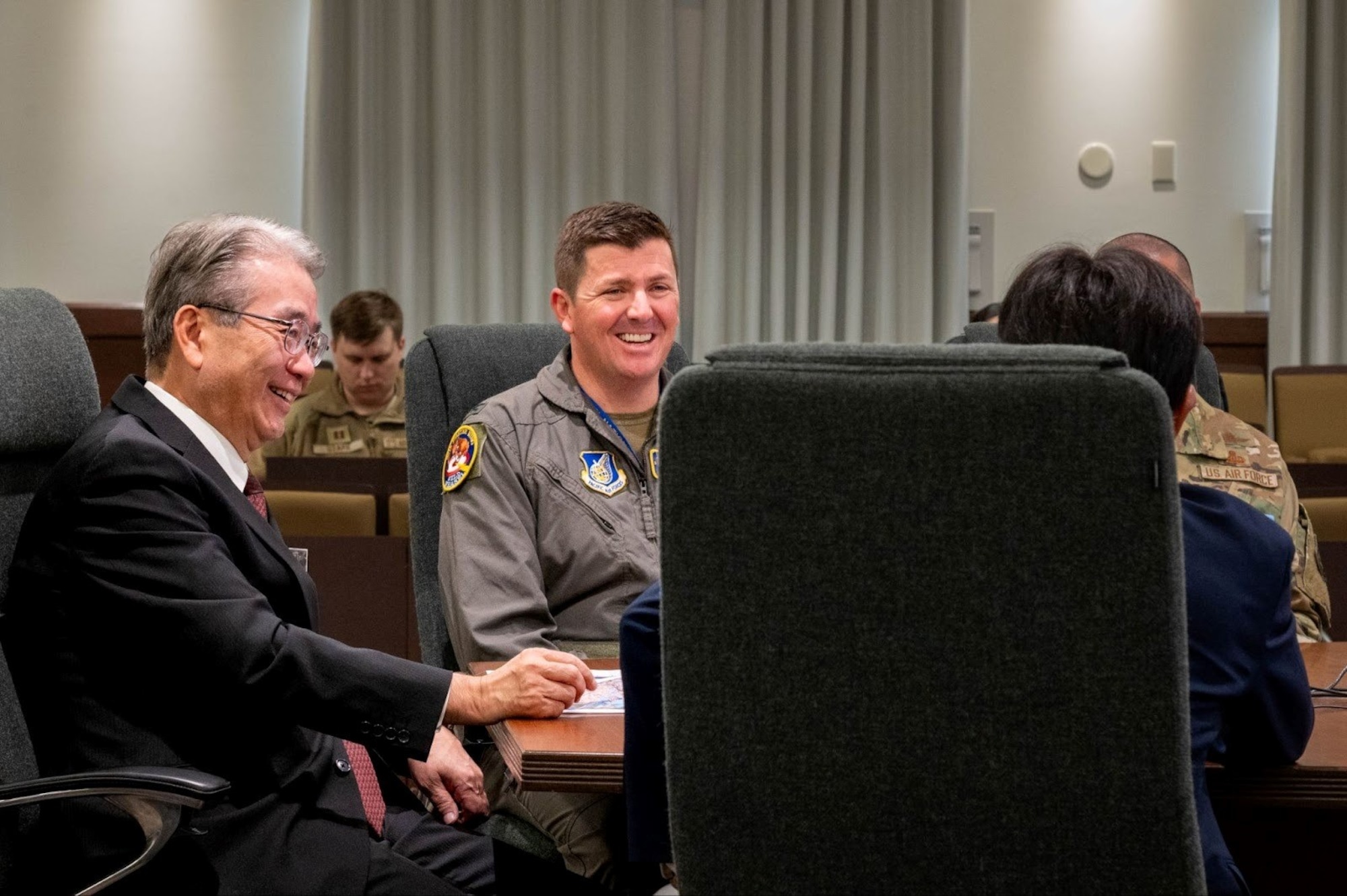 U.S. Air Force Col. Matthew Hoyt, center, 35th Fighter Wing deputy commander, and Ishikawa Keotaro, left, Aomori Mihinoku Bank Ltd. president, attend a meeting at Misawa Air Base, Japan, Nov. 5, 2025.