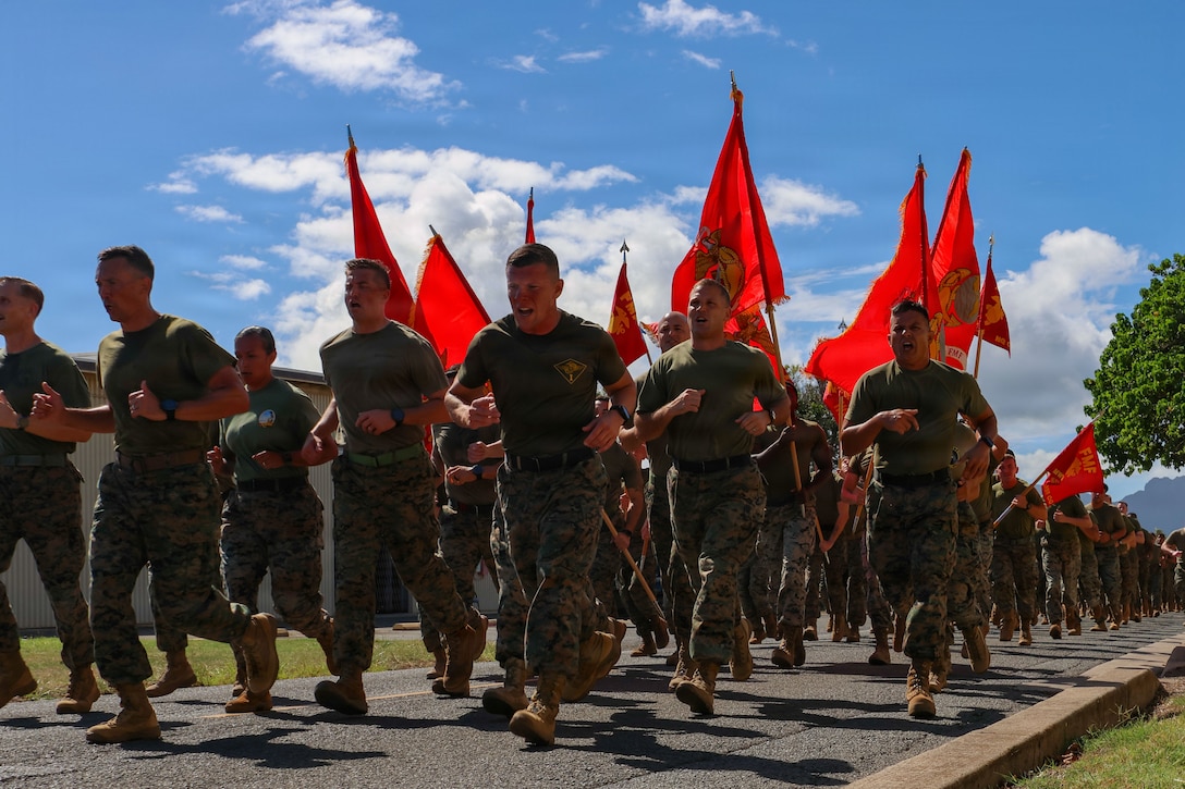 U.S. Marines and Sailors with Marine Aircraft Group (MAG) 24, 1st Marine Aircraft Wing, participate in a formation run at Marine Corps Base Hawaii, Nov 6. 2025. In celebration of the upcoming 250th Marine Corps Birthday, Marines and Sailors with MAG-24 ran 250 miles simultaneously with all 1st MAW units to strengthen unit cohesion and camaraderie. (U.S. Marine Corps photo by Cpl. Anabelle Reed-O’Brien)