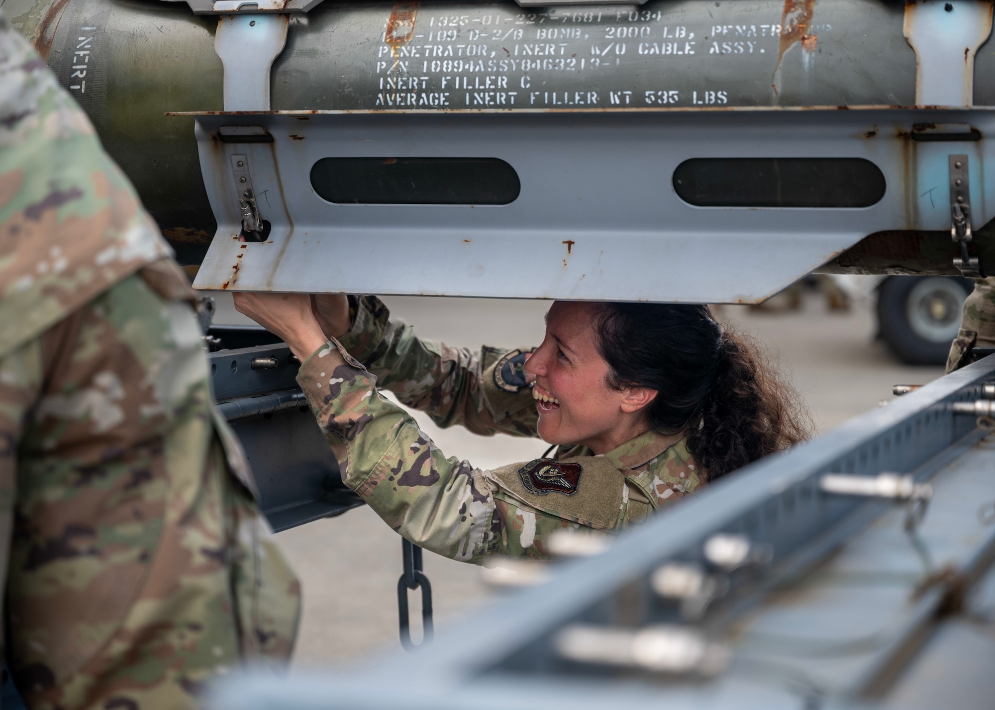 U.S. Air Force Master Sgt. Brittany Pearce, 51st Munitions Squadron munitions flight chief, assembles a bomb during a bomb building competition at Osan Air Base, Republic of Korea, Oct. 2, 2025. The competition fostered teamwork, communication, and pride, ensuring Airmen are not only technically skilled, but also mentally prepared to perform under real-world pressure. (U.S. Air Force photo by Staff Sgt. Sarah Williams)