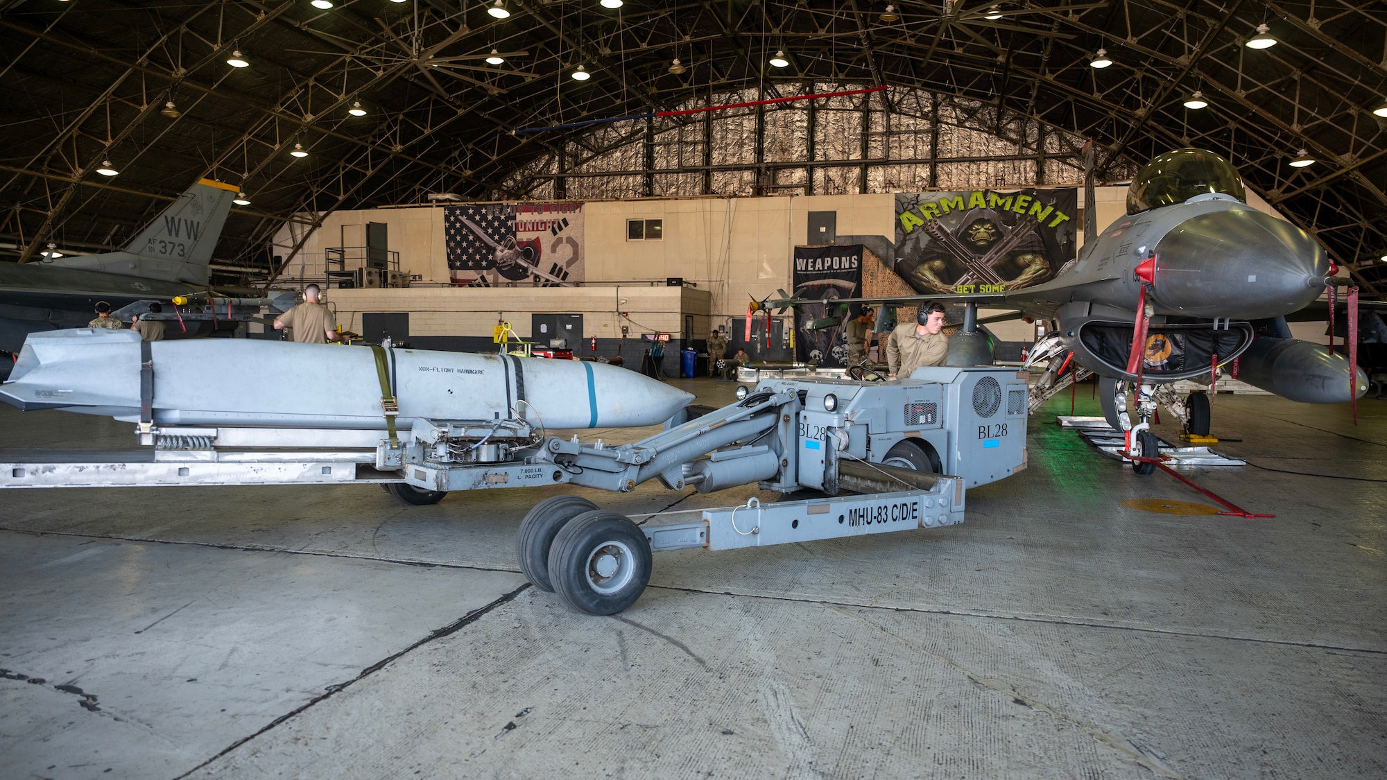 U.S. Air Force Senior Airman Adrian Bethea, 36th Fighter Generation Squadron weapons load crew member, transports an AGM-158 during a weapons loading competition at Osan Air Base, Republic of Korea, Oct. 2, 2025. The competition involved loading F-16 Fighting Falcons in timed environments, simulating the urgency of real-world combat operations. (U.S. Air Force photo by Staff Sgt. Sarah Williams)