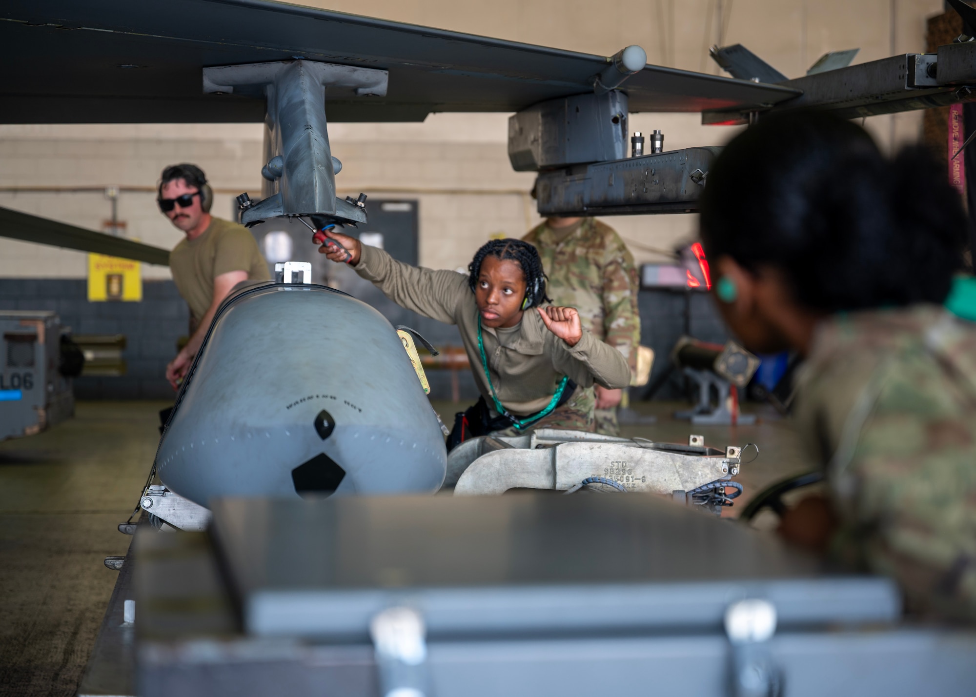 Airmen assigned to the 51st Munitions Squadron attached an AGM-158 during a weapons loading competition at Osan Air Base, Republic of Korea, Oct. 2, 2025. The competition fostered teamwork, communication, and pride, ensuring Airmen are not only technically skilled, but also mentally prepared to perform under real-world pressure. (U.S. Air Force photo by Staff Sgt. Sarah Williams)