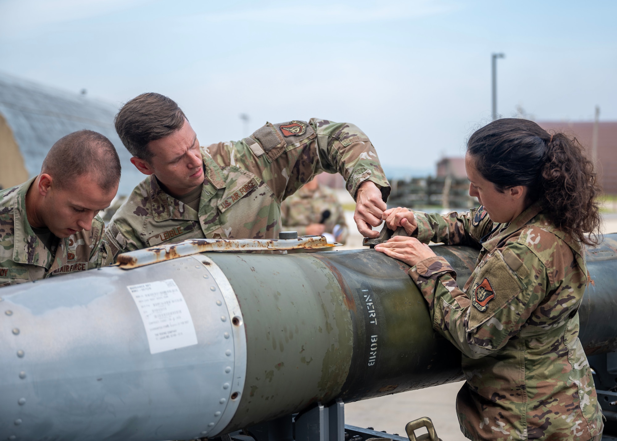 Airmen assigned to the 51st Munitions Squadron prepare munitions during a quarterly load crew competition at Osan Air Base, Republic of Korea, Oct. 2, 2025. Teams are selected from their squadron based-off the fastest load times with zero discrepancies. The winner will move on to compete against other quarterly winners at the end of the year. (U.S. Air Force photo by Staff Sgt. Sarah Williams)