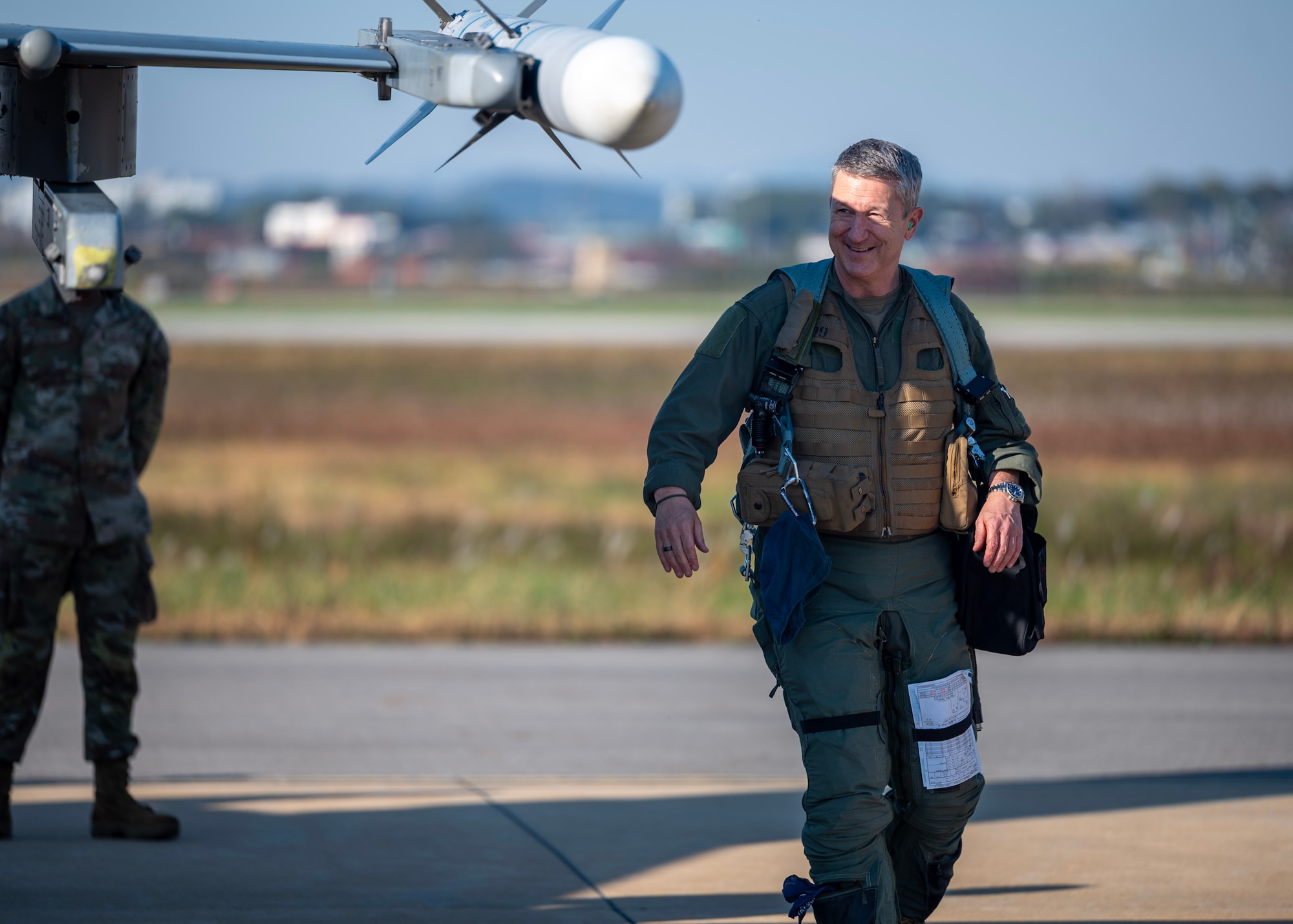 Chairman of the Joint Chiefs of Staff Gen. Dan Caine inspects an F-16 Fighting Falcon before the U.S.-Republic of Korea Combined Command Flight at Osan Air Base, ROK, Nov. 3, 2025. The CJCS and other senior leaders arrived to participate in the Security Consultative Meeting and the Military Cooperation Meeting, highlighting the enduring strength of the U.S.-ROK Alliance. (U.S. Air Force photo by Staff Sgt. Sarah Williams)