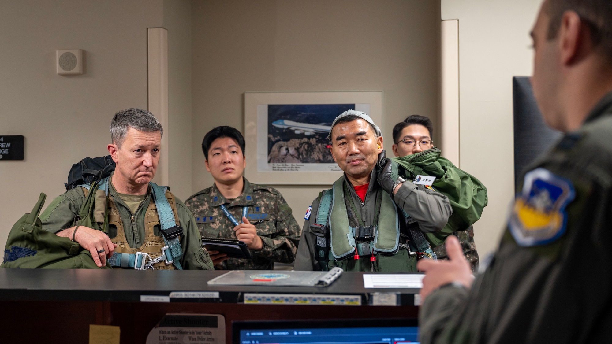 Chairman of the Joint Chiefs of Staff Gen. Dan Caine and the Republic of Korea Chairman of the Joint Chiefs of Staff Gen. Jin Yong Sung participate in a preflight brief before the U.S.-ROK Combined Command Flight at Osan Air Base, ROK, Nov. 3, 2025. The CJCS and other senior leaders arrived to participate in the Security Consultative Meeting and the Military Cooperation Meeting, highlighting the enduring strength of the U.S.-ROK Alliance. (U.S. Air Force photo by Staff Sgt. Sarah Williams)