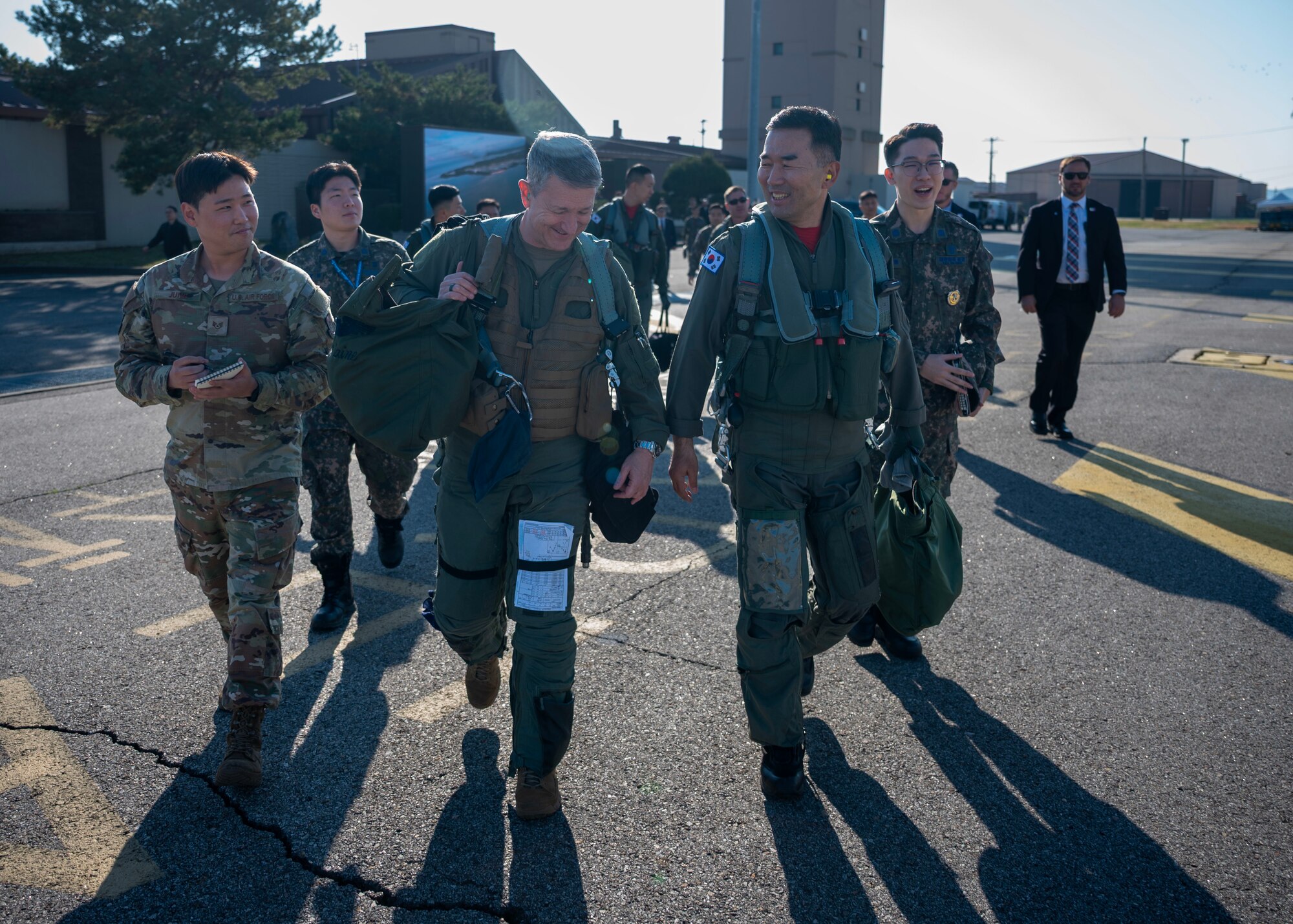 Chairman of the Joint Chiefs of Staff Gen. Dan Caine and the Republic of Korea Chairman of the Joint Chiefs of Staff Gen. Jin Yong Sung step to their jets before the U.S.-ROK Combined Command Flight at Osan Air Base, ROK, Nov. 3, 2025. The CJCS and other senior leaders arrived to participate in the Security Consultative Meeting and the Military Cooperation Meeting, highlighting the enduring strength of the U.S.-ROK Alliance. (U.S. Air Force photo by Staff Sgt. Sarah Williams)
