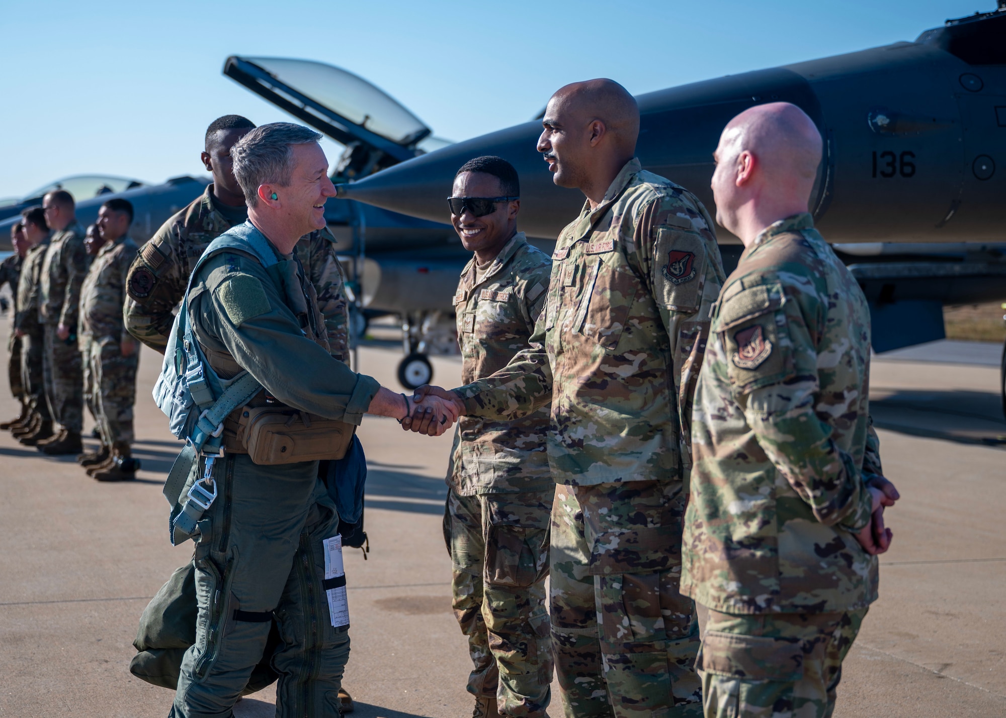 Chairman of the Joint Chiefs of Staff Gen. Dan Caine greets Airmen before the U.S.-Republic of Korea Combined Command Flight at Osan Air Base, ROK, Nov. 3, 2025. The CJCS and other senior leaders arrived to participate in the Security Consultative Meeting and the Military Cooperation Meeting, highlighting the enduring strength of the U.S.-ROK Alliance. (U.S. Air Force photo by Staff Sgt. Sarah Williams)