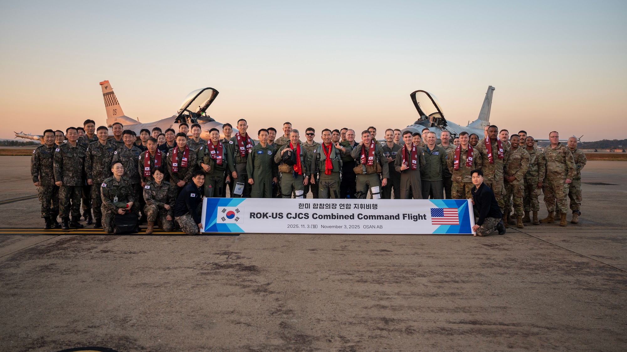 Chairman of the Joint Chiefs of Staff Gen. Dan Caine and the Republic of Korea Chairman of the Joint Chiefs of Staff Gen. Jin Yong Sung take a group photo after the U.S.-ROK Combined Command Flight at Osan Air Base, ROK, Nov. 3, 2025. The CJCS and other senior leaders arrived to participate in the Security Consultative Meeting and the Military Cooperation Meeting, highlighting the enduring strength of the U.S.-ROK Alliance. (U.S. Air Force photo by Staff Sgt. Sarah Williams)