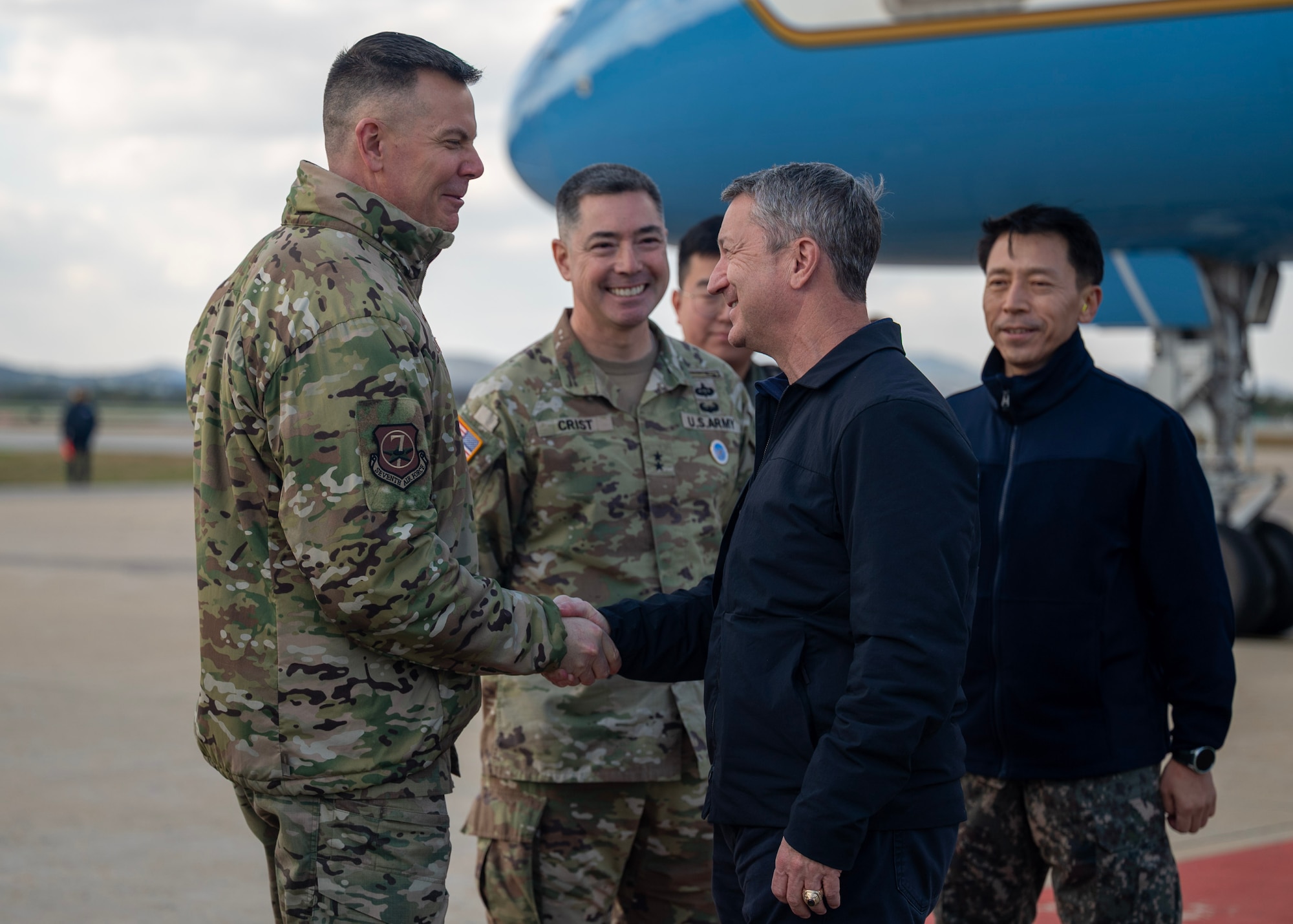 U.S. Air Force Brig. Gen. Kurt Helphinstine, Seventh Air Force deputy commander, greets the Chairman of the Joint Chiefs of Staff Gen. Dan Caine at Osan Air Base, Republic of Korea, Nov. 2, 2025. The CJCS and other senior leaders arrived to participate in the Security Consultative Meeting and the Military Cooperation Meeting, highlighting the enduring strength of the U.S.-ROK Alliance. (U.S. Air Force photo by Staff Sgt. Sarah Williams)
