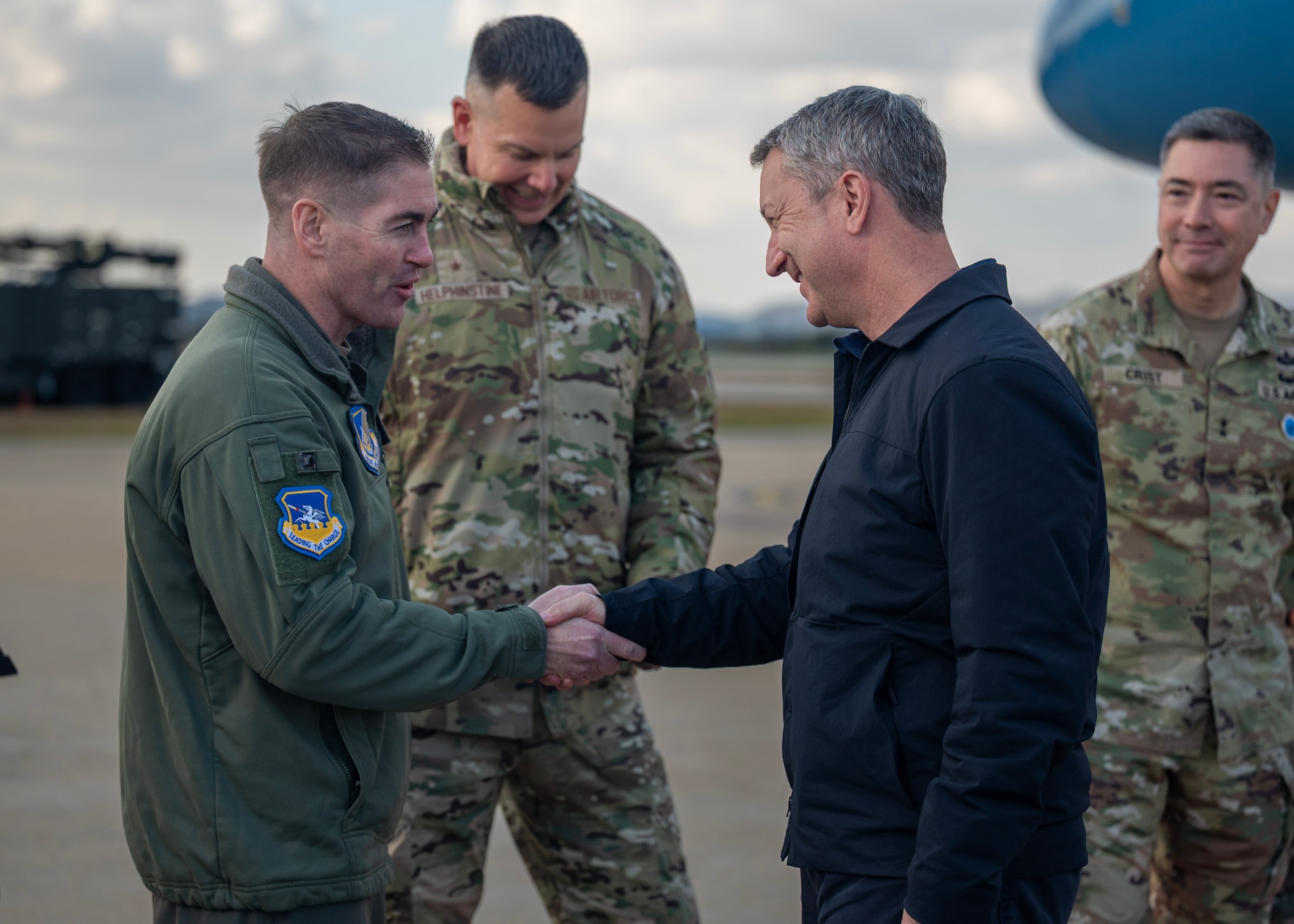 U.S. Air Force Col. Kevin Walsh, 51st Fighter Wing deputy commander, greets the Chairman of the Joint Chiefs of Staff Gen. Dan Caine at Osan Air Base, Republic of Korea, Nov. 2, 2025. The CJCS and other senior leaders arrived to participate in the Security Consultative Meeting and the Military Cooperation Meeting, highlighting the enduring strength of the U.S.-ROK Alliance. (U.S. Air Force photo by Staff Sgt. Sarah Williams)
