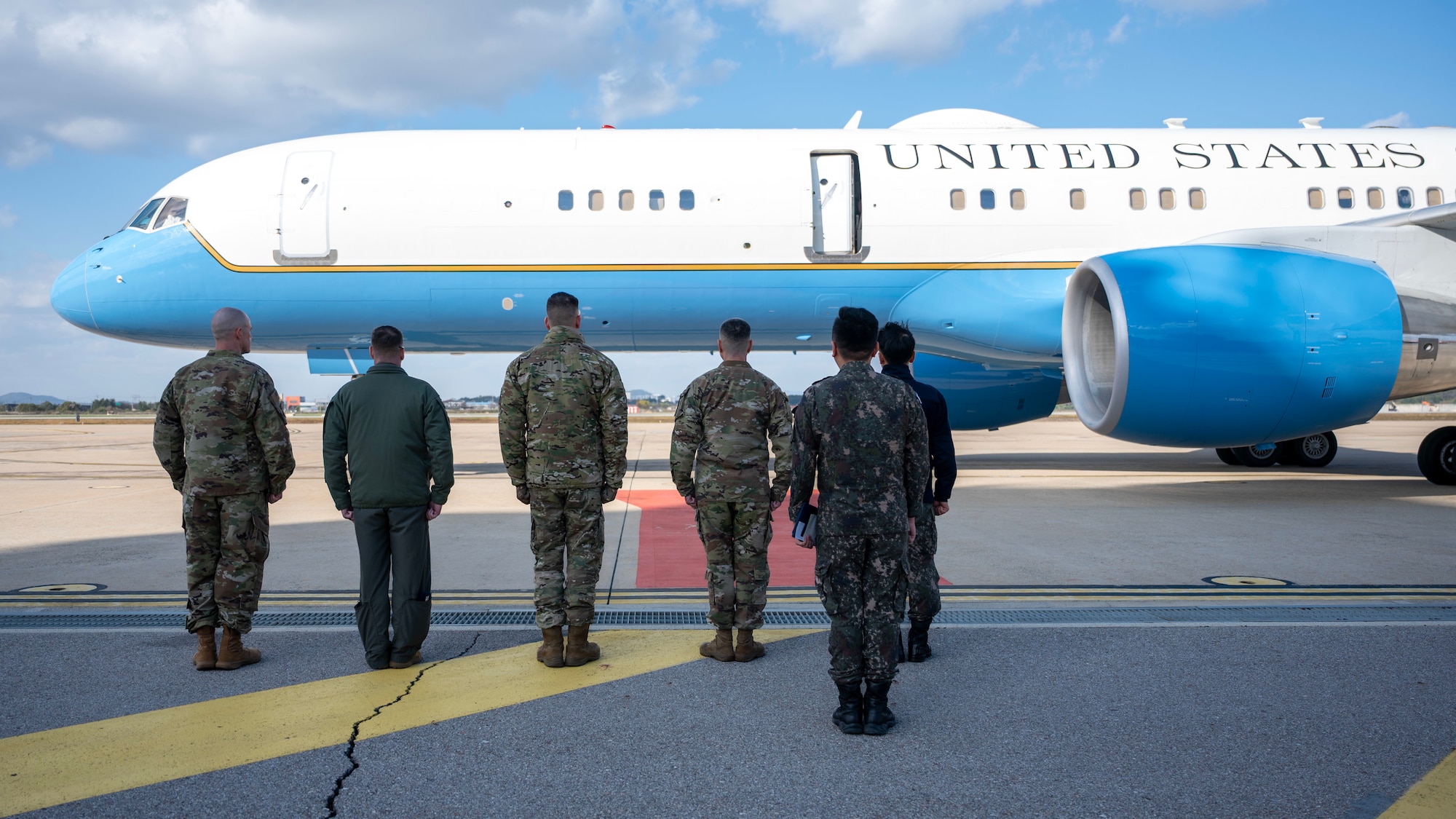United States Forces Korea and Osan Air Base leadership welcome the Chairman of the Joint Chiefs of Staff Gen. Dan Caine at Osan Air Base, Republic of Korea, Nov. 2, 2025. The CJCS and other senior leaders arrived to participate in the Security Consultative Meeting and the Military Cooperation Meeting, highlighting the enduring strength of the U.S.-ROK Alliance. (U.S. Air Force photo by Staff Sgt. Sarah Williams)