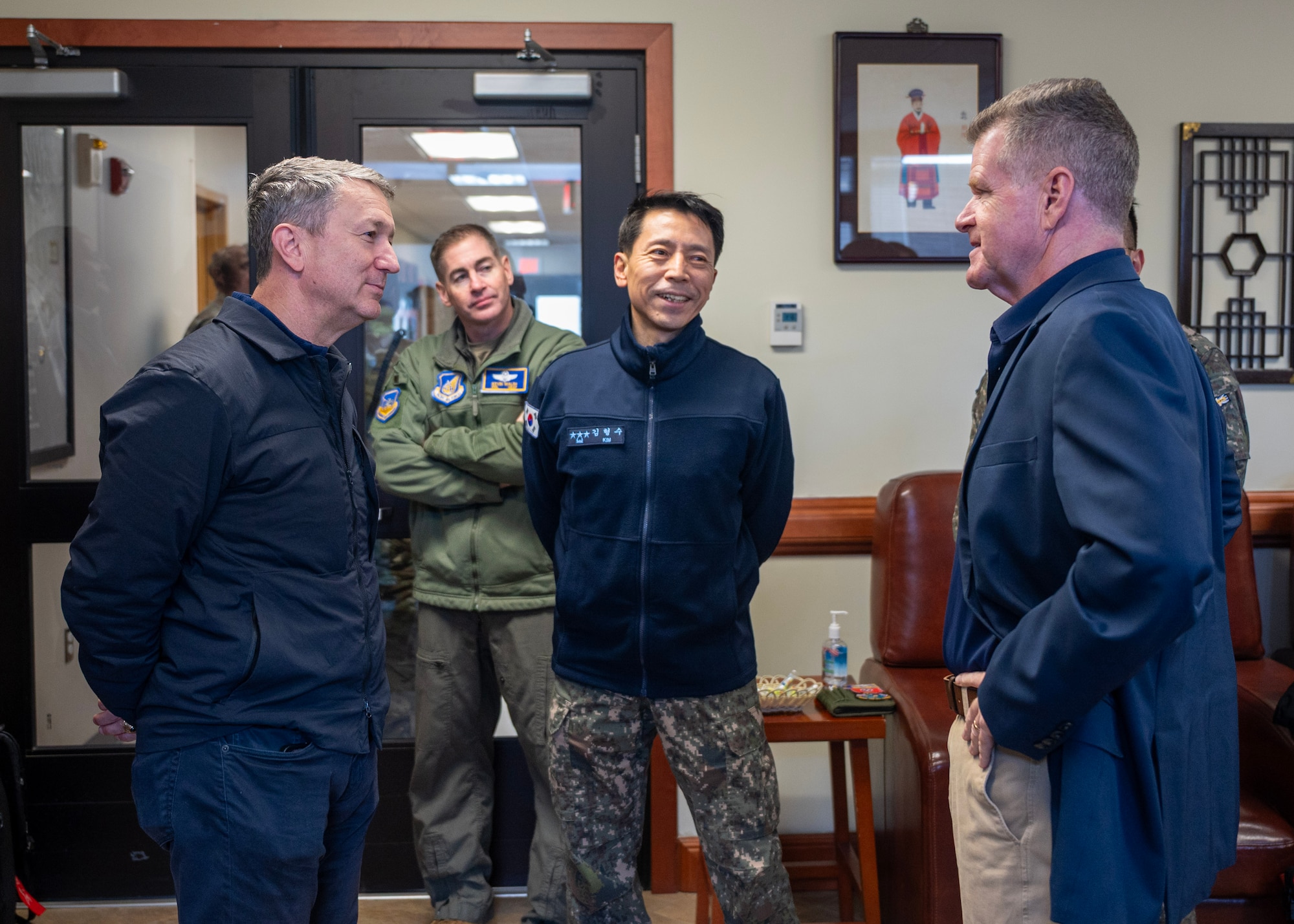 Chairman of the Joint Chiefs of Staff Gen. Dan Caine, left, talks with Republic of Korea Lt. Gen. Kim Hyoung Soo, center, commander of ROKAF Operations Command, and U.S. Navy Adm. Samuel Paparo, U.S. Indo-Pacific Command commander, at Osan Air Base, ROK, Nov. 2, 2025. The CJCS and other senior leaders arrived to participate in the Security Consultative Meeting and the Military Cooperation Meeting, highlighting the enduring strength of the U.S.-ROK Alliance. (U.S. Air Force photo by Staff Sgt. Sarah Williams)