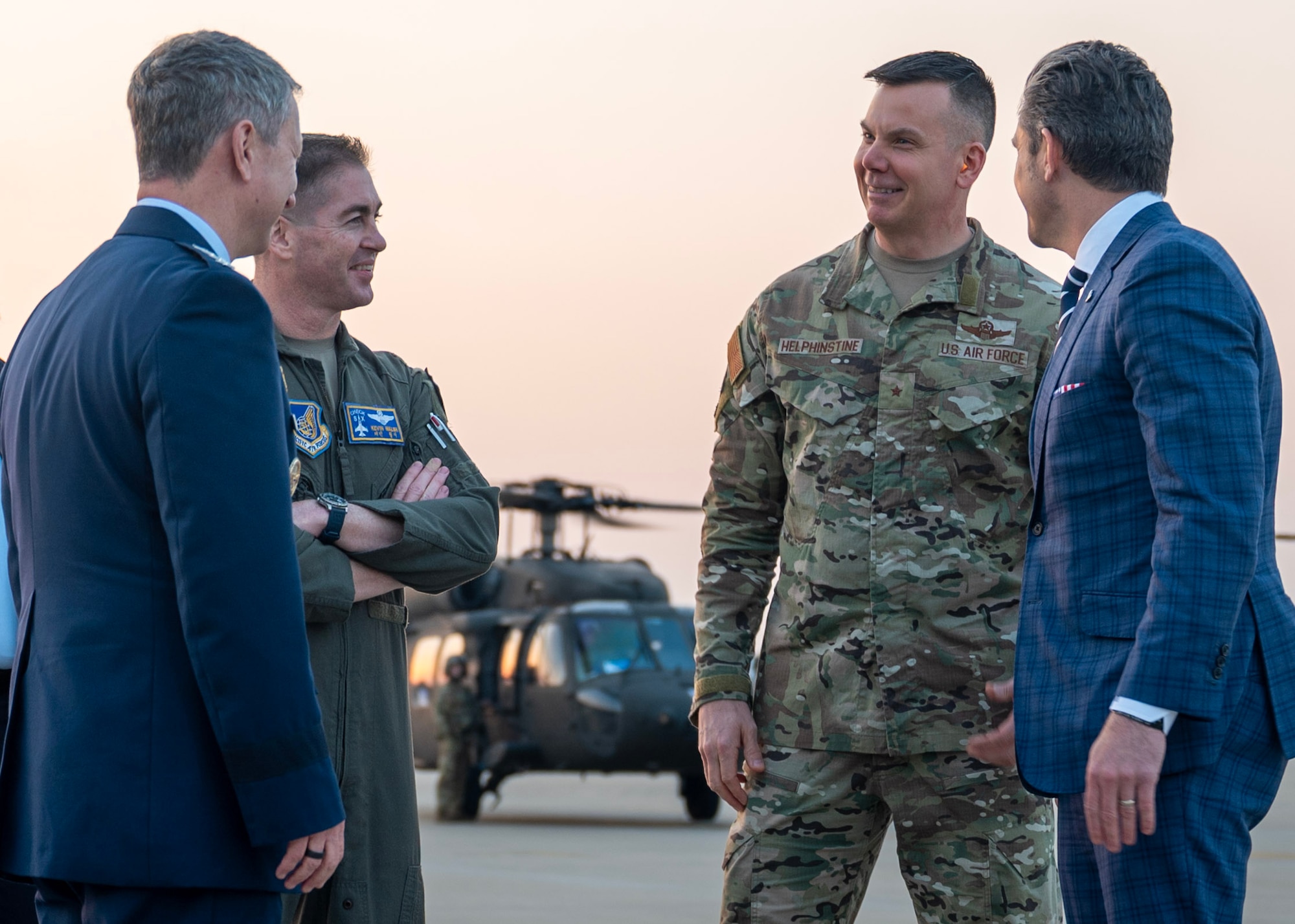 Chairman of Joint Chiefs of Staff Dan Caine, left; U.S. Air Force Col. Kevin Walsh, center left, 51st Fighter Wing deputy commander; Brig. Gen. Kurt Helphinstine, center right, Seventh Air Force deputy commander; and Secretary of War Pete Hegseth talk at Osan Air Base, Republic of Korea, Nov. 4, 2025. Hegseth and other senior leaders arrived to participate in the Security Consultative Meeting and the Military Cooperation Meeting, highlighting the enduring strength of the U.S.-ROK Alliance. (U.S. Air Force photo by Staff Sgt. Sarah Williams)