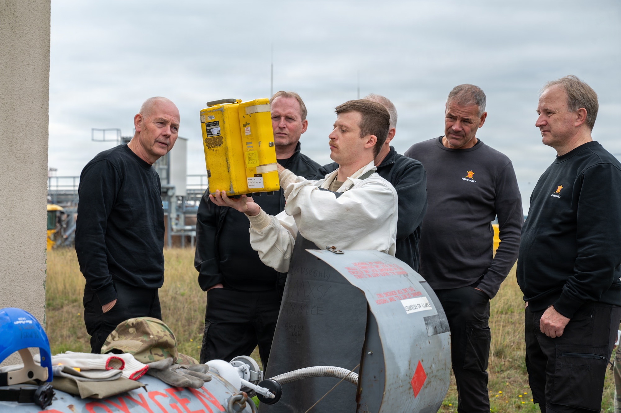 U.S. Air Force Staff Sgt. Joshua Snyder, 86th Maintenance Squadron electrical and environmental craftsman, shows Royal Norwegian Air Force aerospace ground equipment service members a dual efficiency meter for a liquid oxygen cart at Ramstein Air Base, Germany, Oct. 8, 2025.