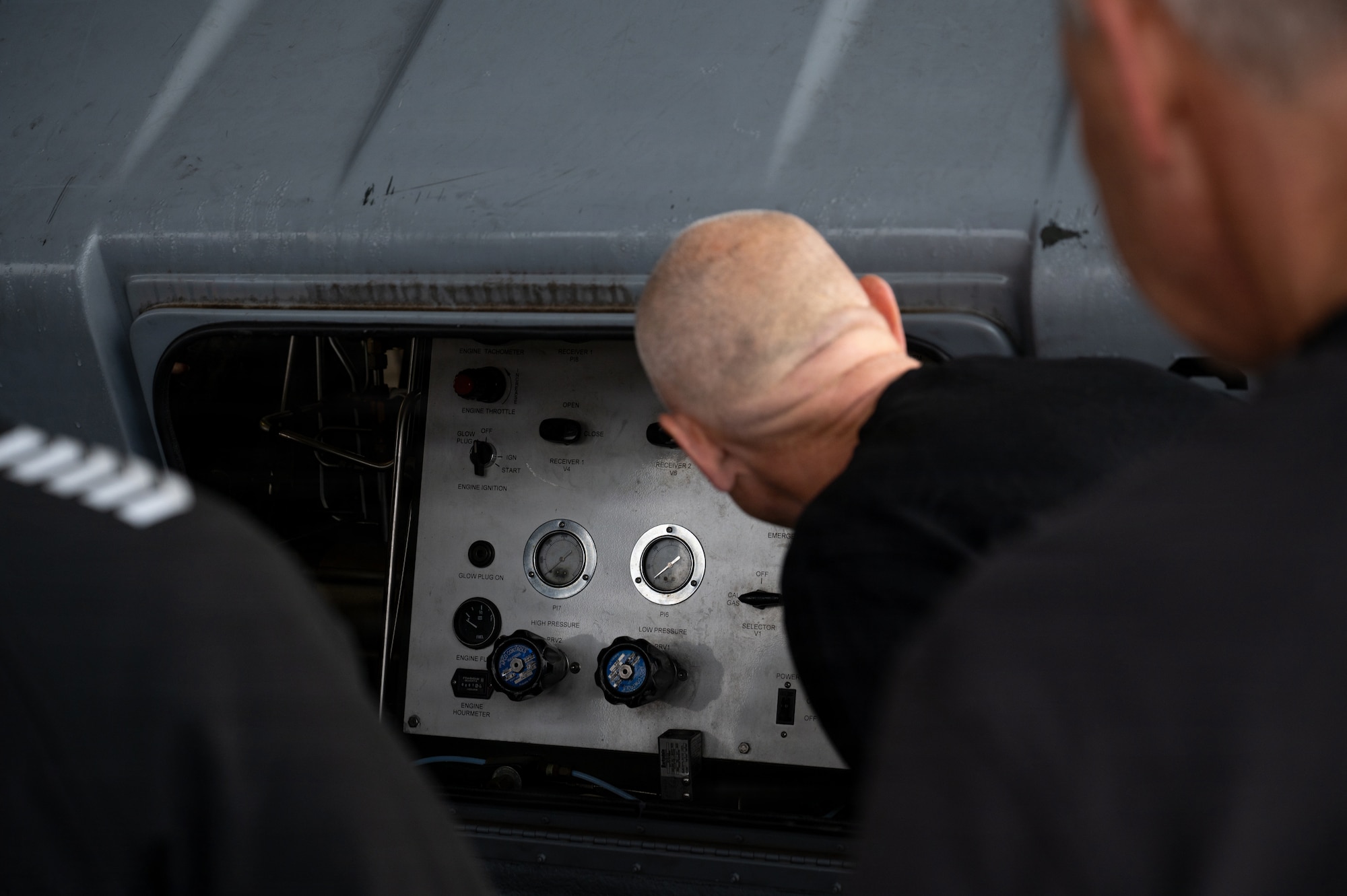 Royal Norwegian Air Force aerospace ground equipment service members look at the inner workings of a self-generating nitrogen servicing cart at Ramstein Air Base, Germany, Oct. 8, 2025.