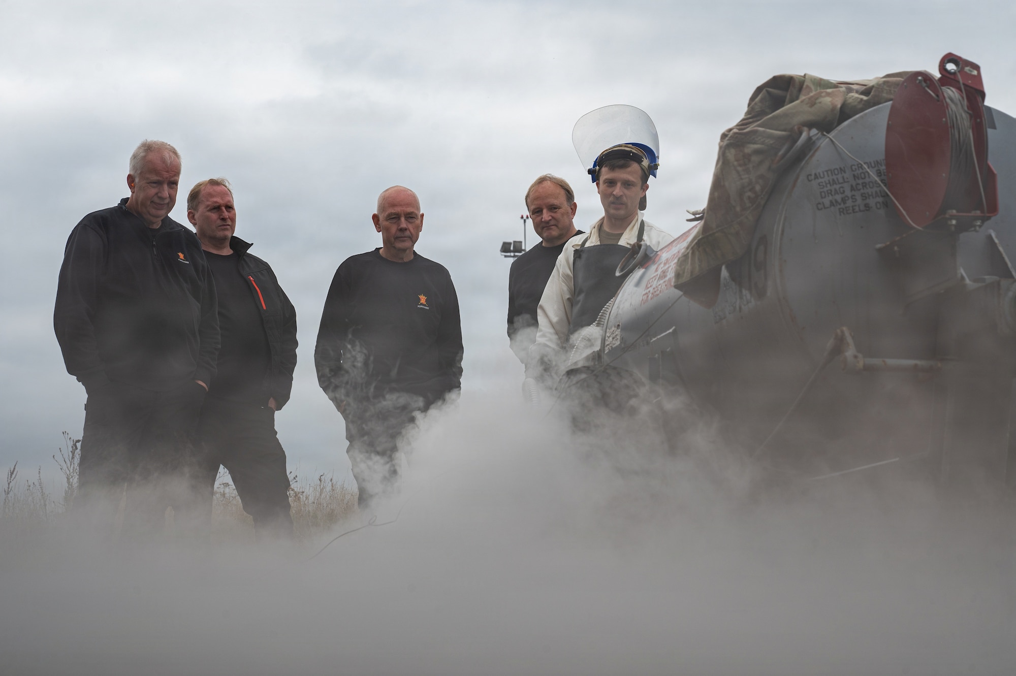 U.S. Air Force Staff Sgt. Joshua Snyder, 86th Maintenance Squadron electrical and environmental craftsman, demonstrates how a liquid oxygen cart works to Royal Norwegian Air Force aerospace ground equipment service members at Ramstein Air Base, Germany, Oct. 8, 2025.