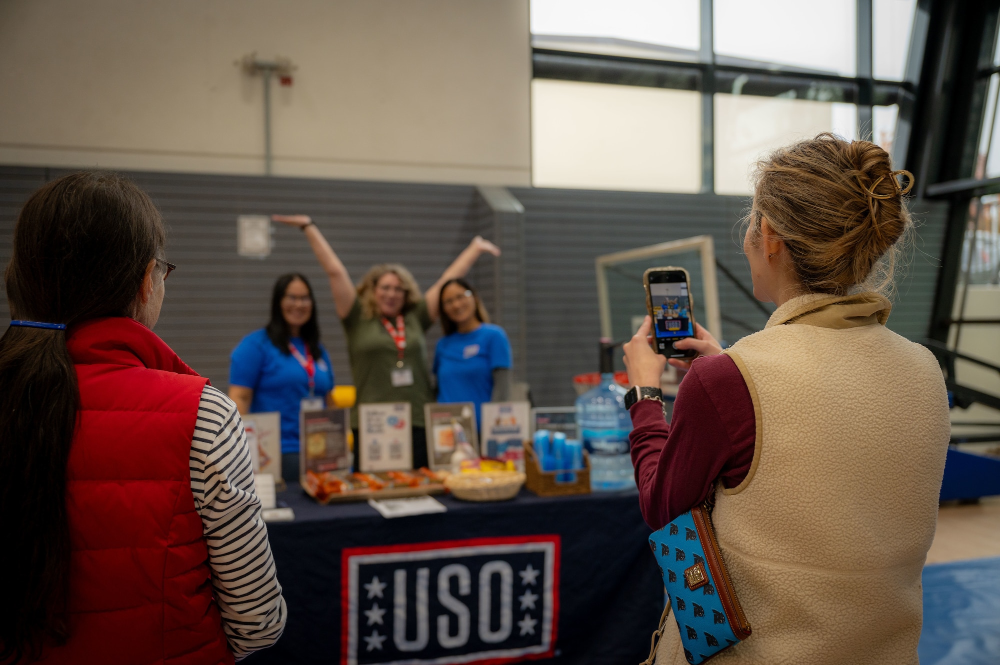 Volunteers from The USO pose for a group photo during the October PT Month Health Fair at Ramstein Air Base, Germany, Oct. 17, 2025.